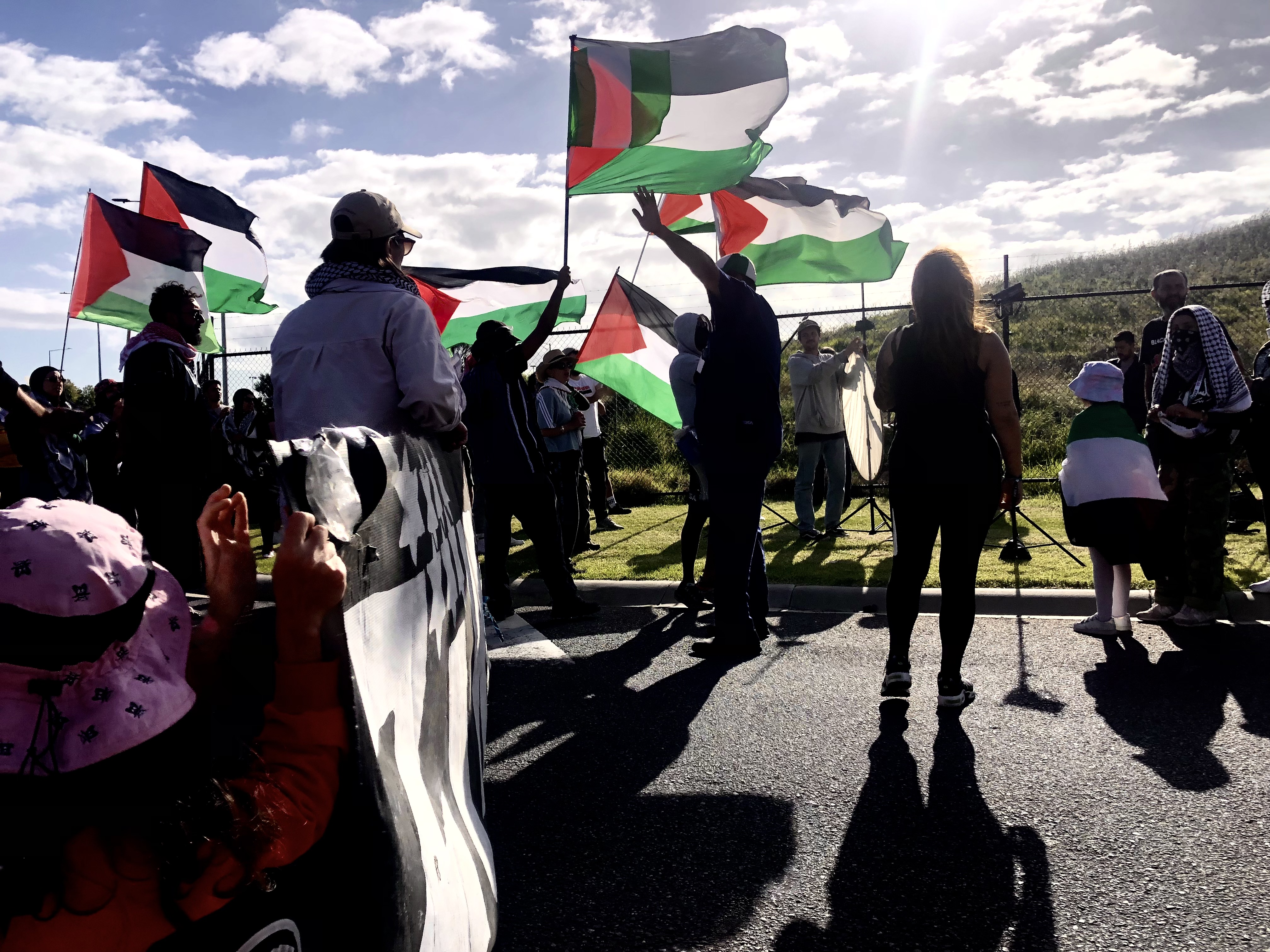Protesters waving Palestinian flags in Melbourne