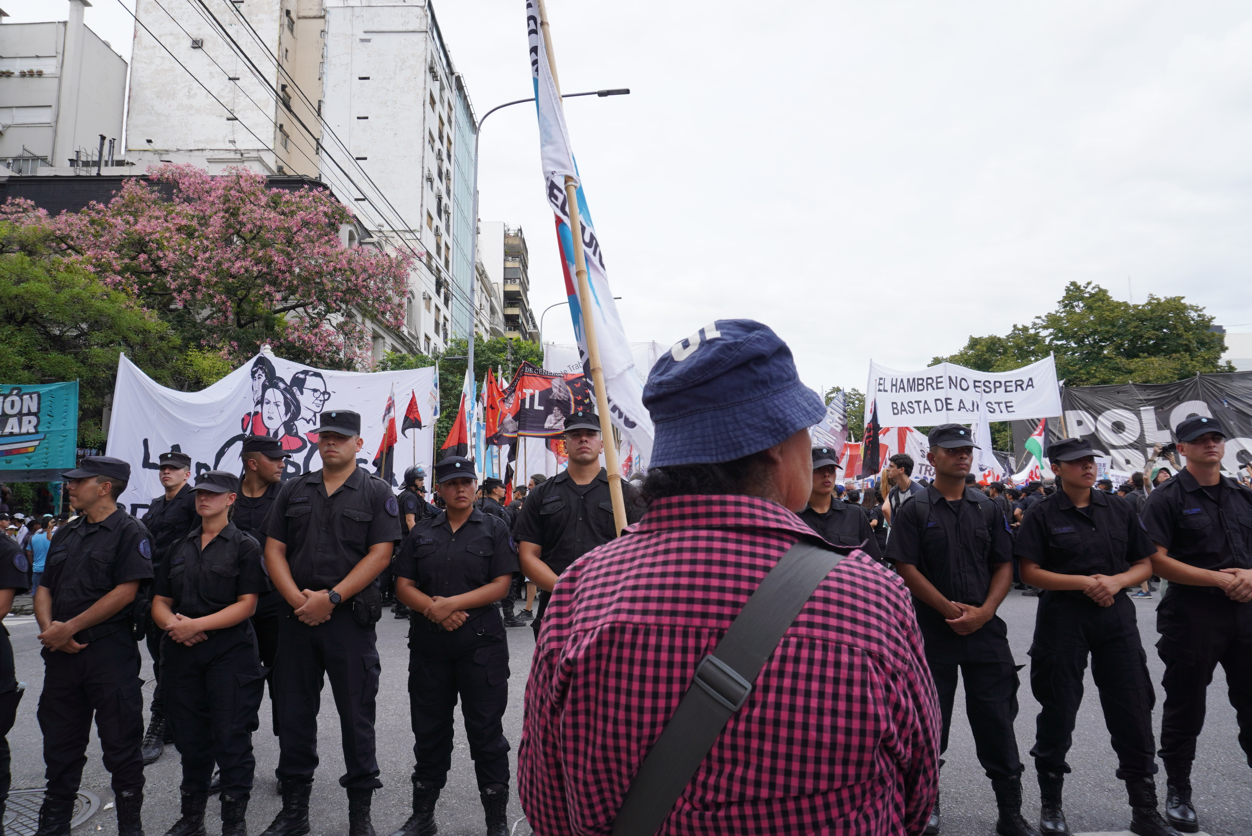A protester confronts a row of police officers near the Ministry of Human Capital in Buenos Aires, Argentina, on February 23