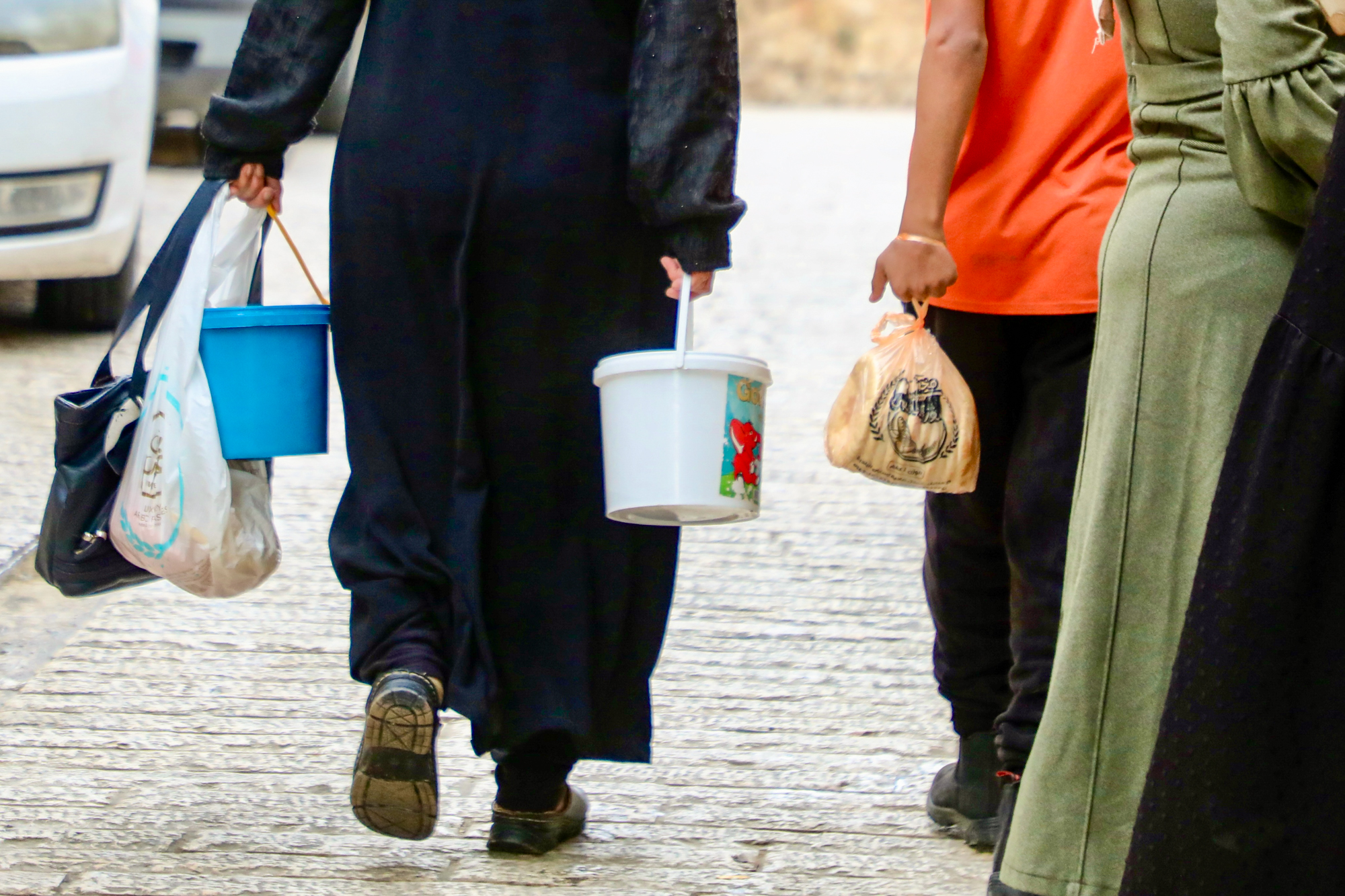 people walking away with food