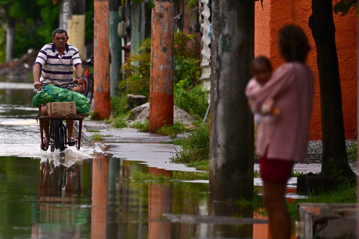 Brazil races to save flood victims as storm death toll rises