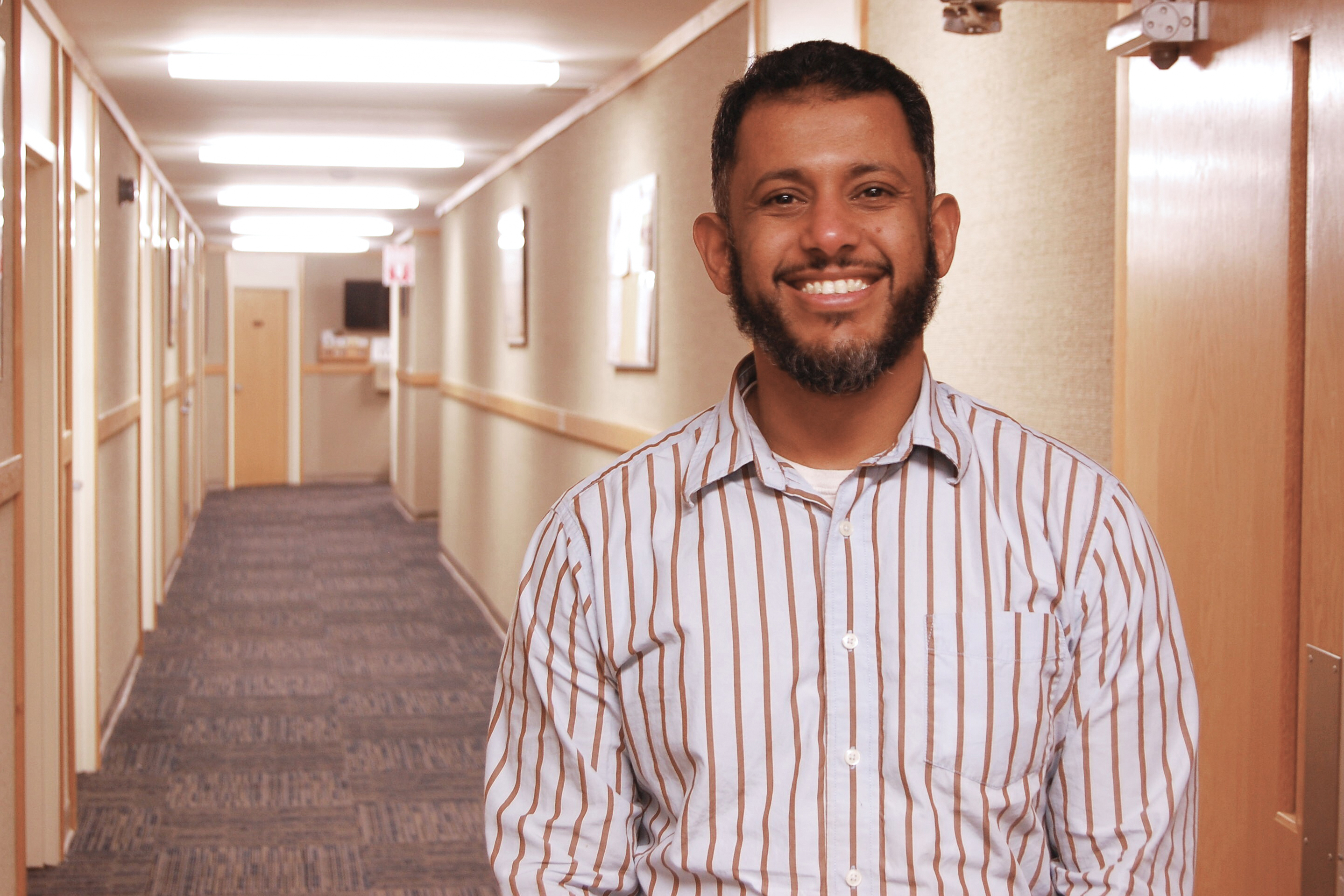 Fuad Al-Amoody, vice president of the Islamic Society of Vermont (ISV), stands in a hallway at the mosque in South Burlington, Vermont