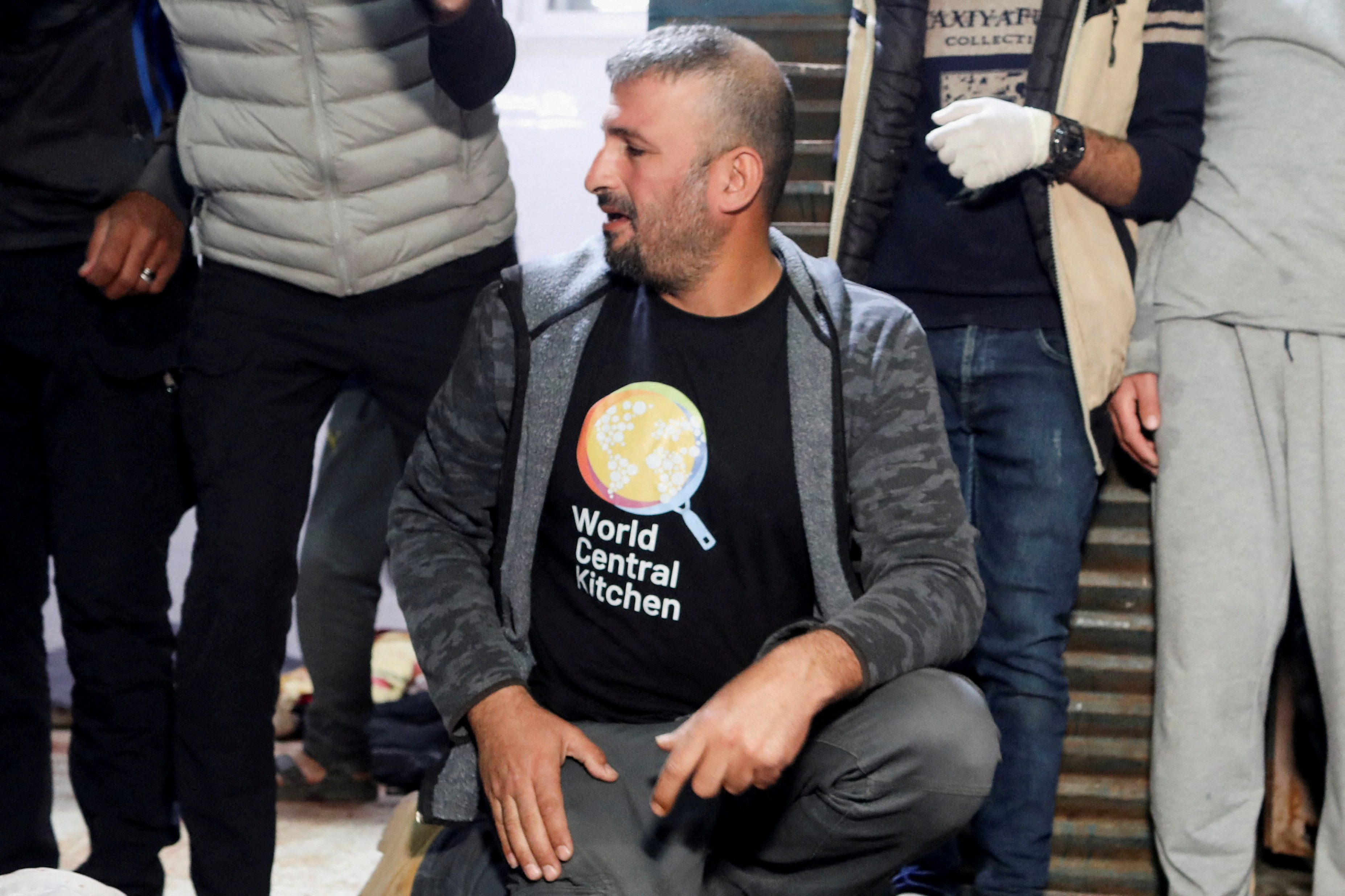 A mourner reacts next to the bodies of employees from the World Central Kitchen (WCK) non-governmental organization, including foreigners, who were killed in an Israeli airstrike according to the Hamas-run Gaza government media office but the Israeli military said it was conducting a thorough review at the highest levels to understand the circumstances of this "tragic" incident, at Al-Aqsa hospital in Deir Al-Balah, in the central Gaza Strip April 1, 2024. REUTERS/Ramadan Abed