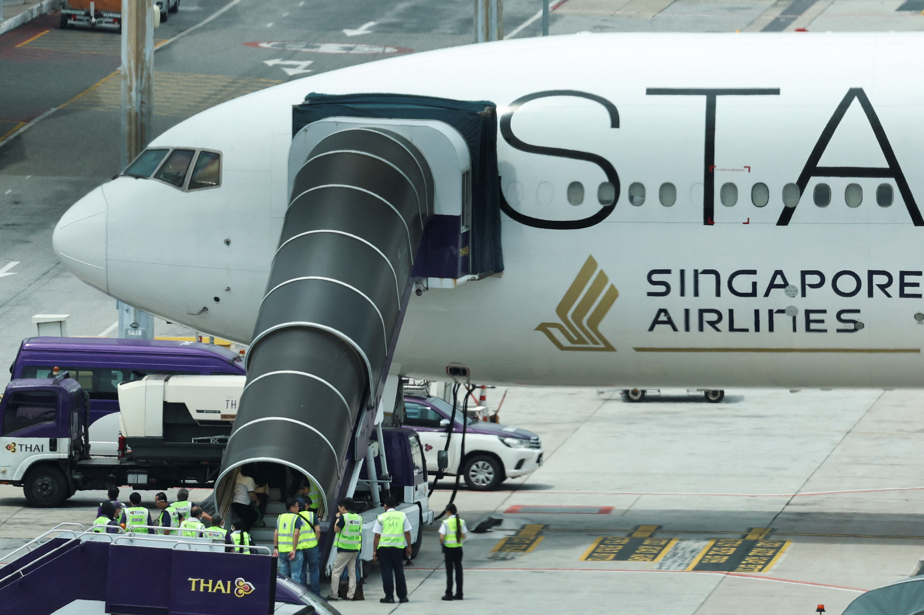flight SQ321 parked on the tarmac after an emergency landing at Suvarnabhumi International Airport, in Bangkok,