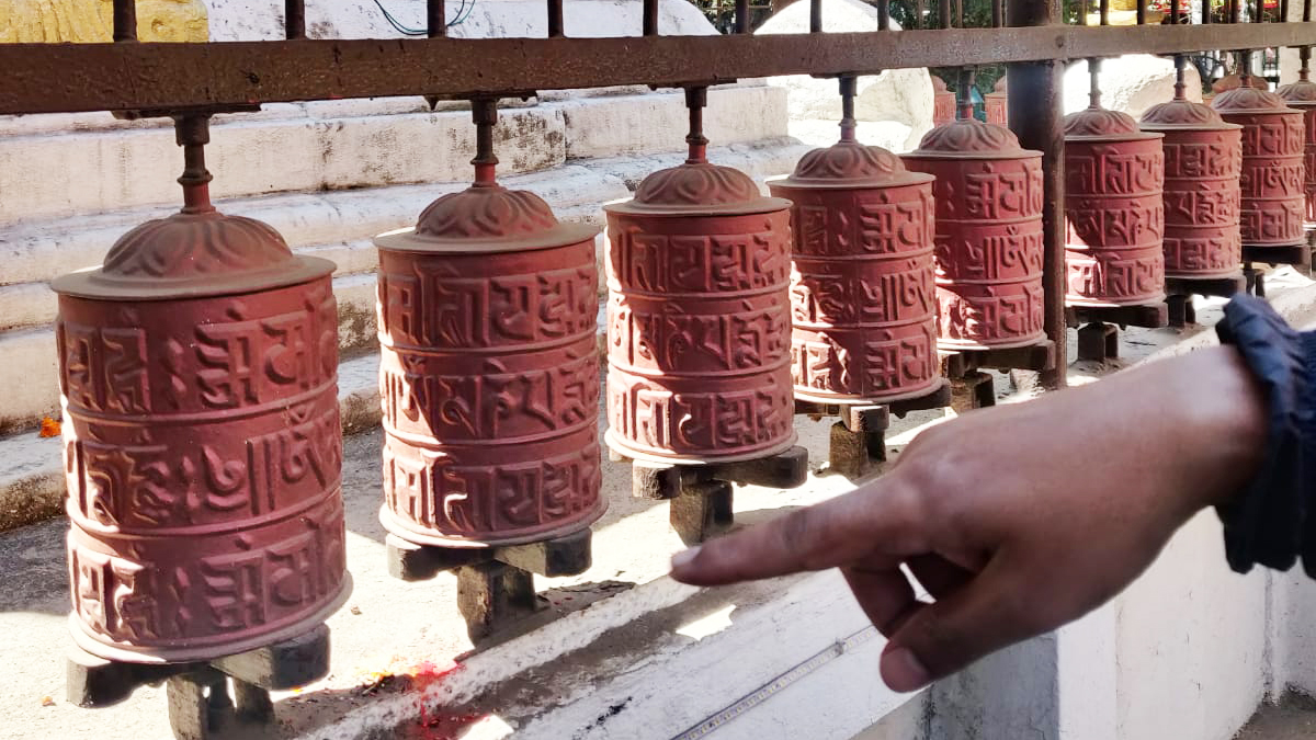 On a tour around the Thahiti neighbourhood, Ananda Maharjan, founder of Callijatra, points to copper-coloured prayer wheels inside a stupa, explaining ‘The top and the bottom script is Ranjana Lipi’