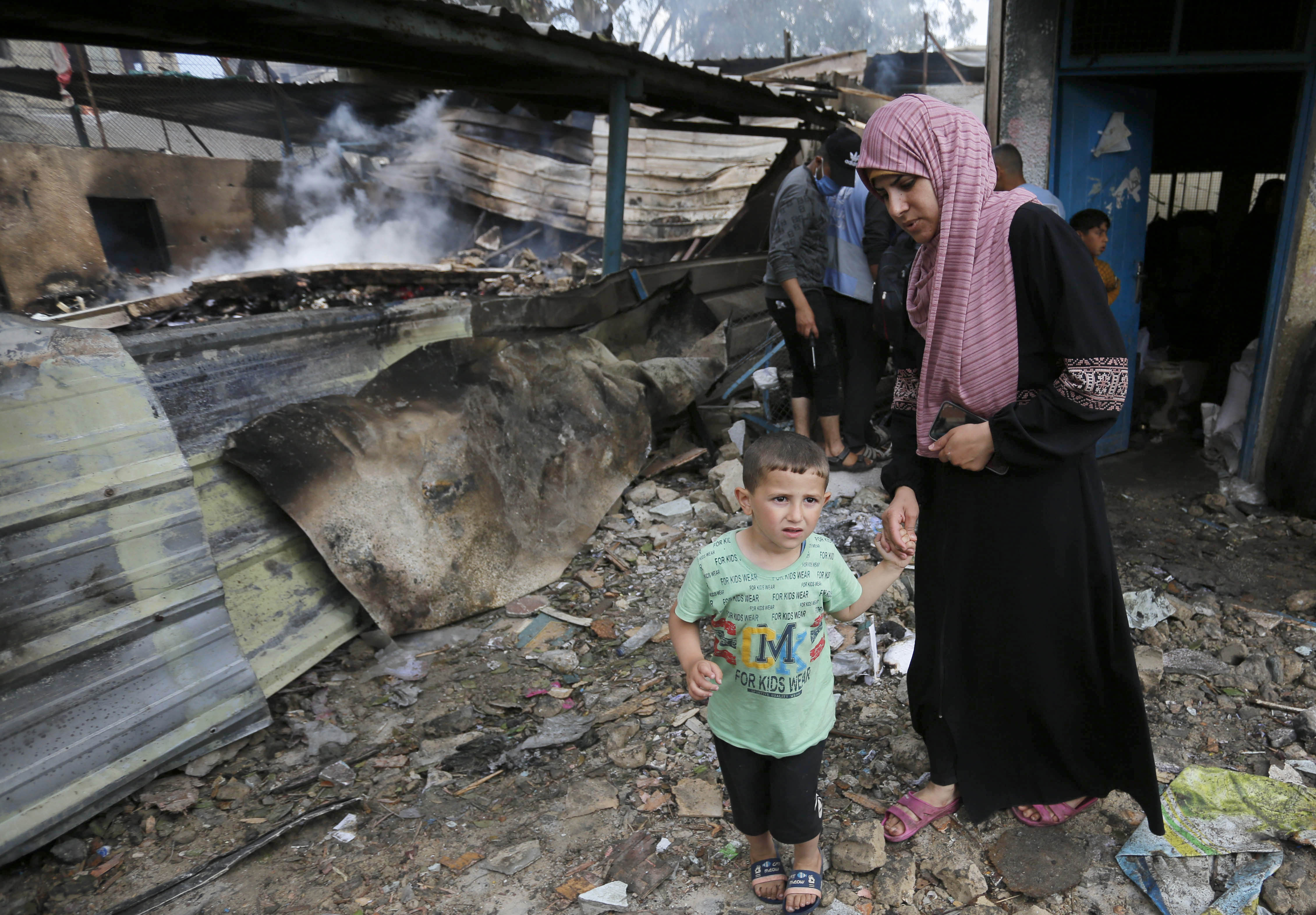 People struggle to survive as Israeli forces attacked a school belonging to the UN agency for Palestinian refugees
