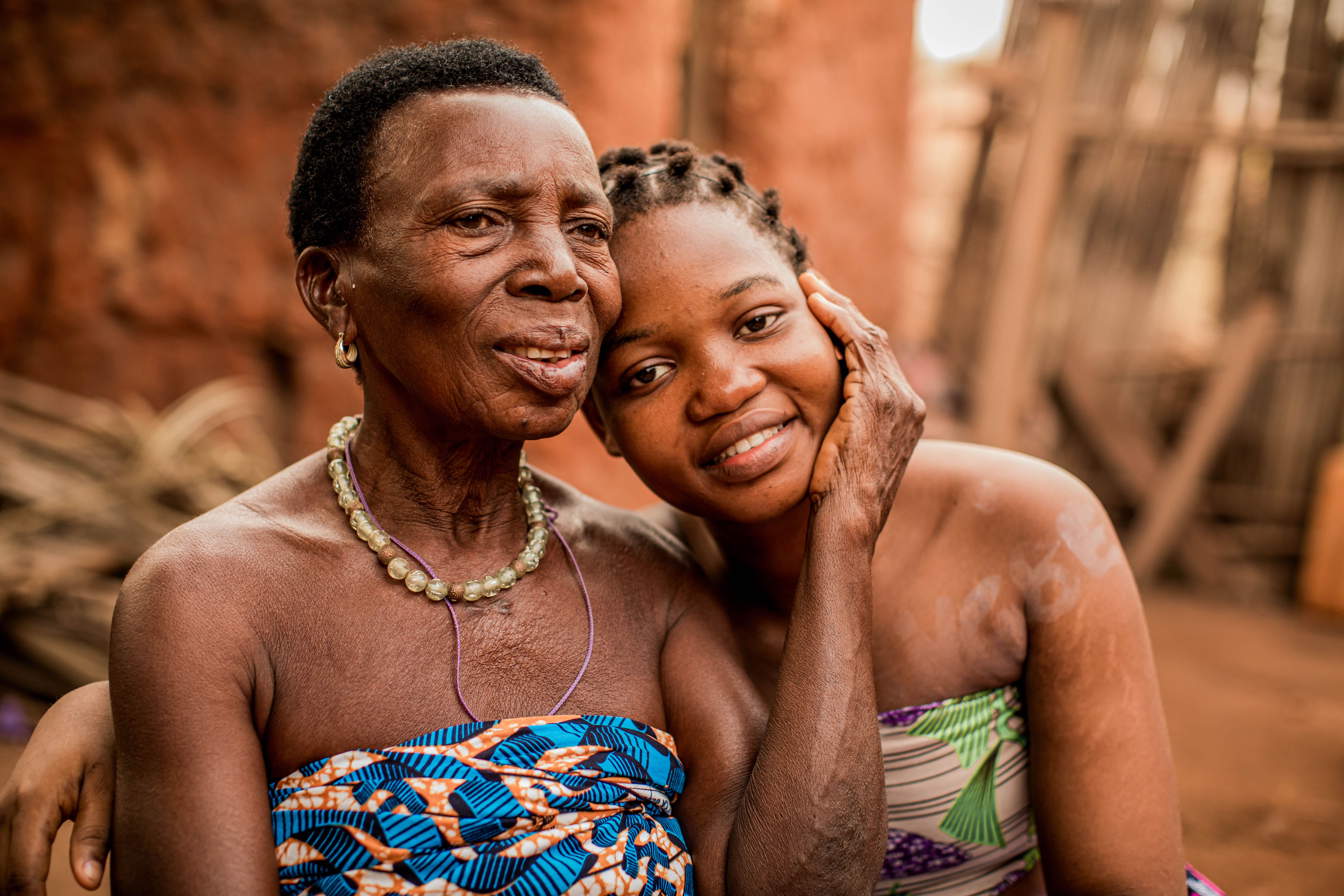 Angel, 80, pictured with her granddaughter, Blanche, 18, in Benin