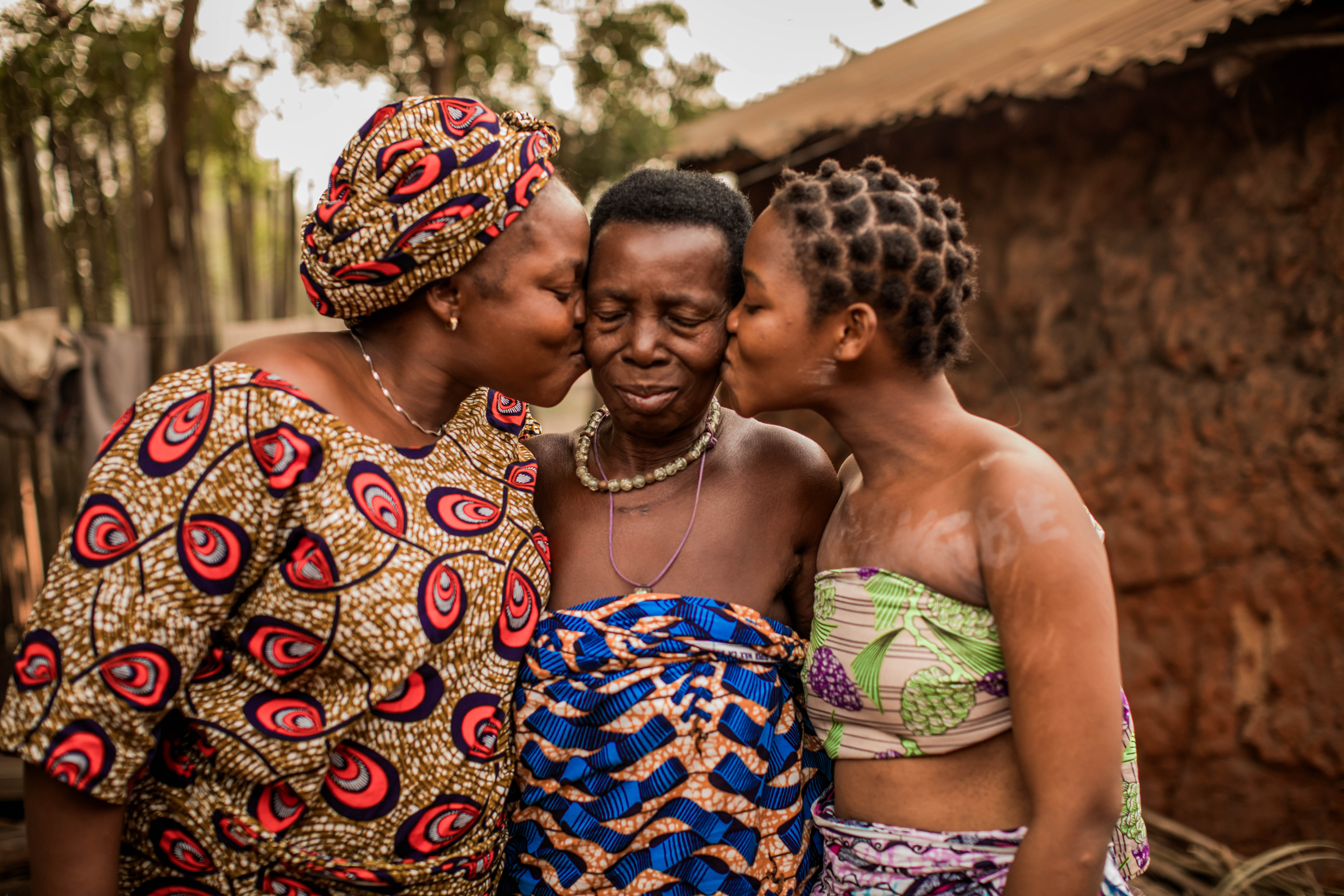 Teenager Blanche, 18 (pictured right), with her grandmother, Angel, 80, (centre), and her mother, Pierrette, 42, (left), both of whom Blanche calls ‘Dada’, at home in Benin