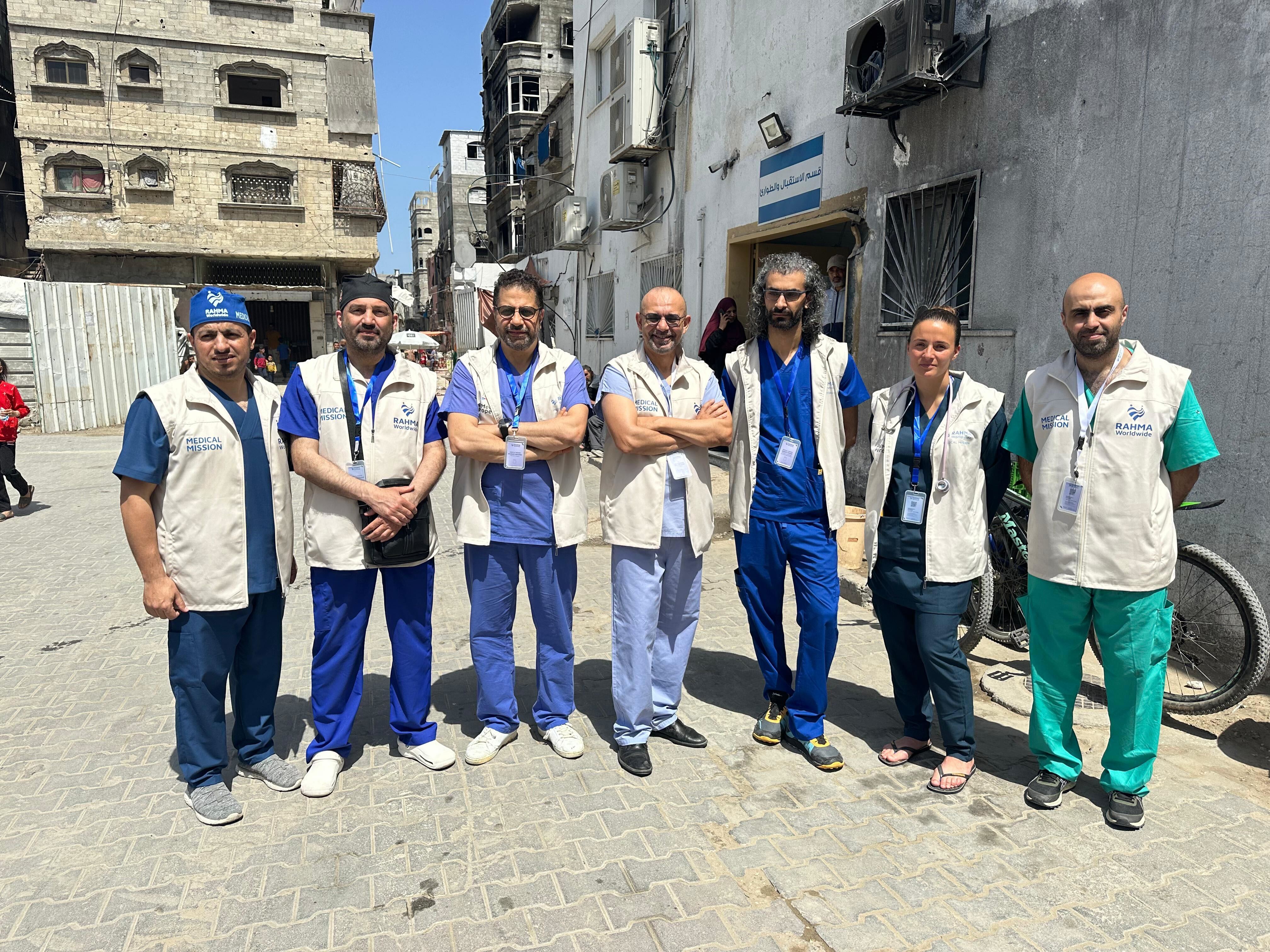 Dr Lahna, center, with his colleagues at PalMed Europe and Rahma International in Gaza [Courtesy of Zouhair Lahna]