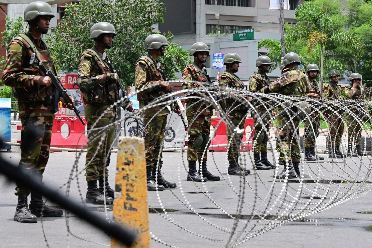 Bangladesh army personnel stand guard near the parliament house