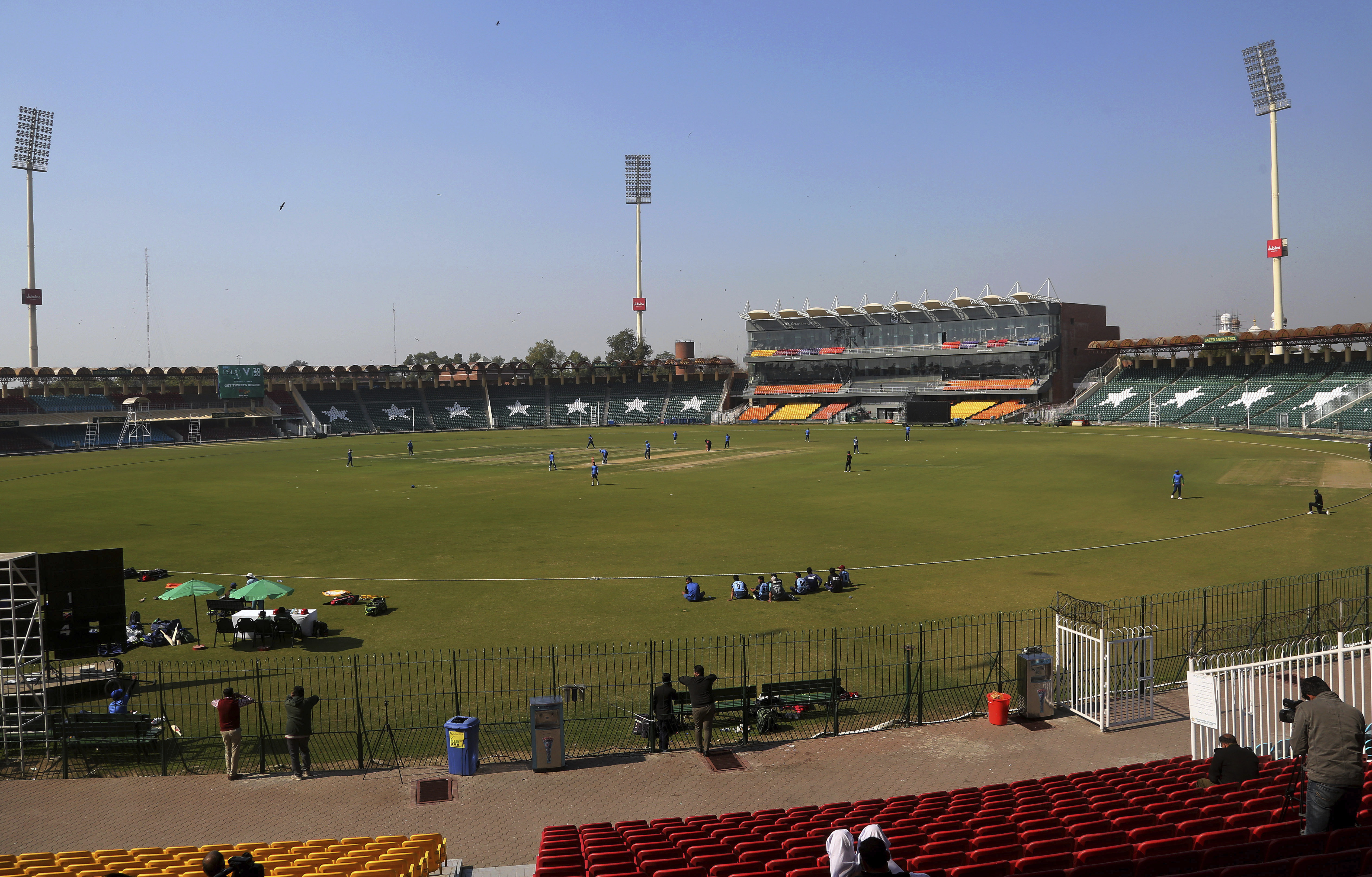 Wide shot of cricket stadium.