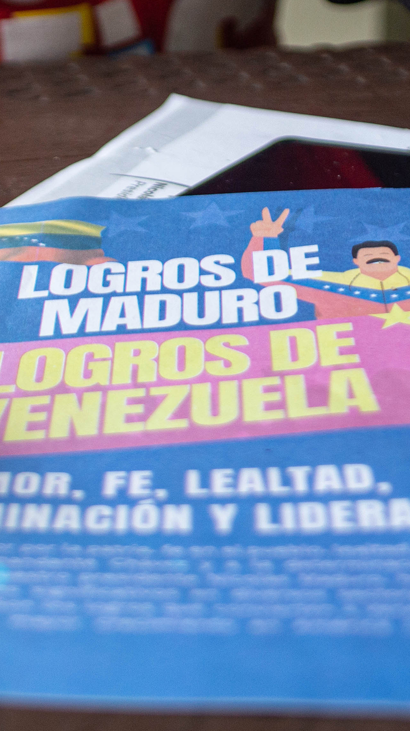 A pamphlet with a cartoon Maduro that reads in Spanish: "The accomplishments of Maduro, the accomplishments of Venezuela"
