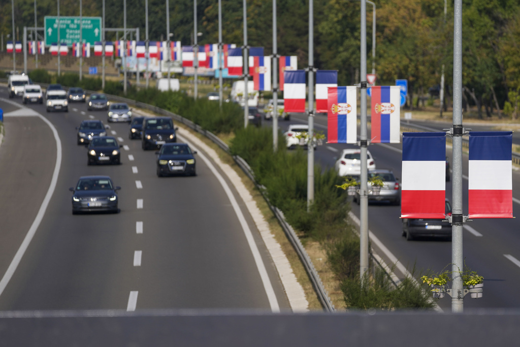 French and Serbian flags line a road in Belgrade