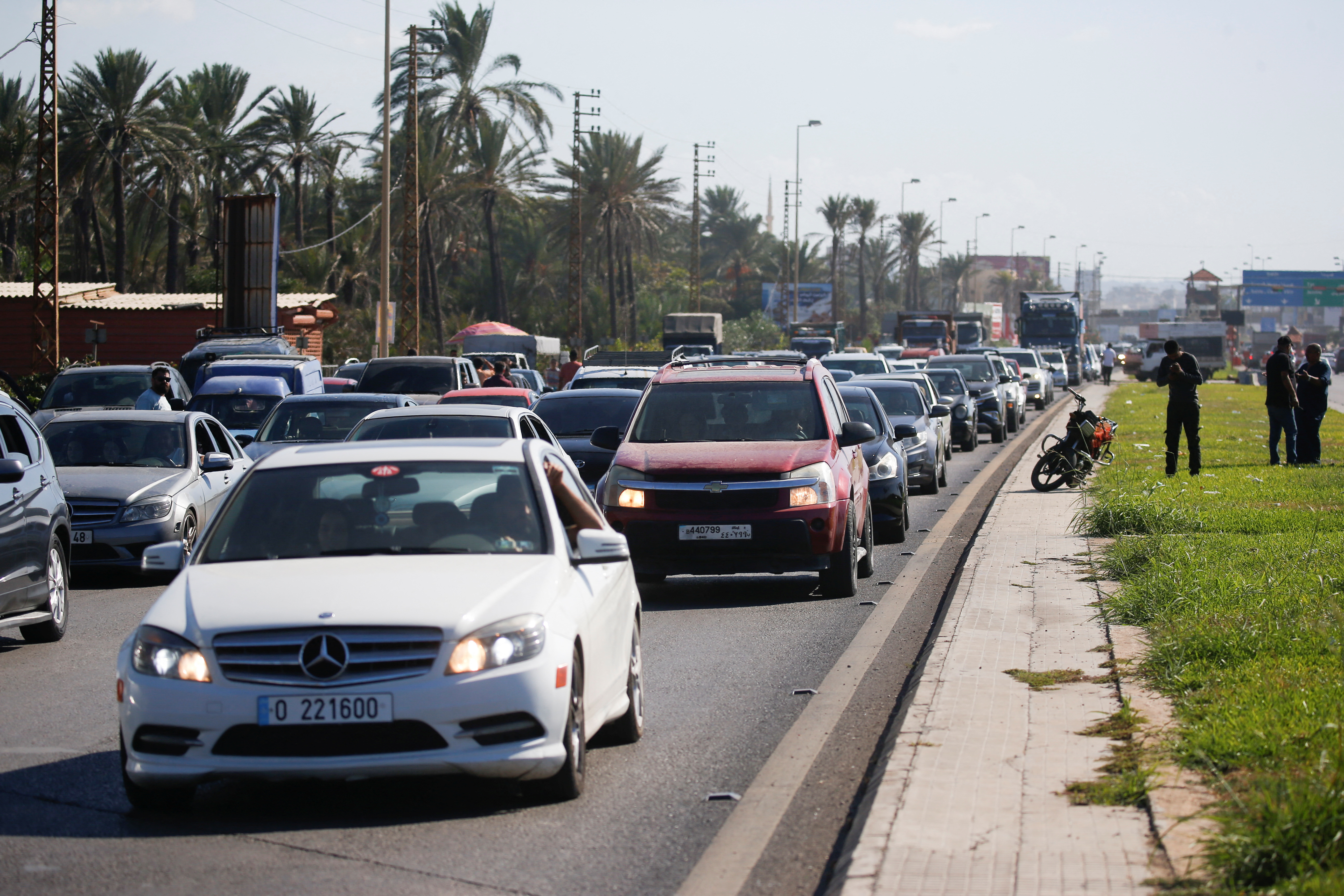 People in heavy traffic drive north from Lebanon's southern coastal city Sidon as some of them flee Israeli bombardment