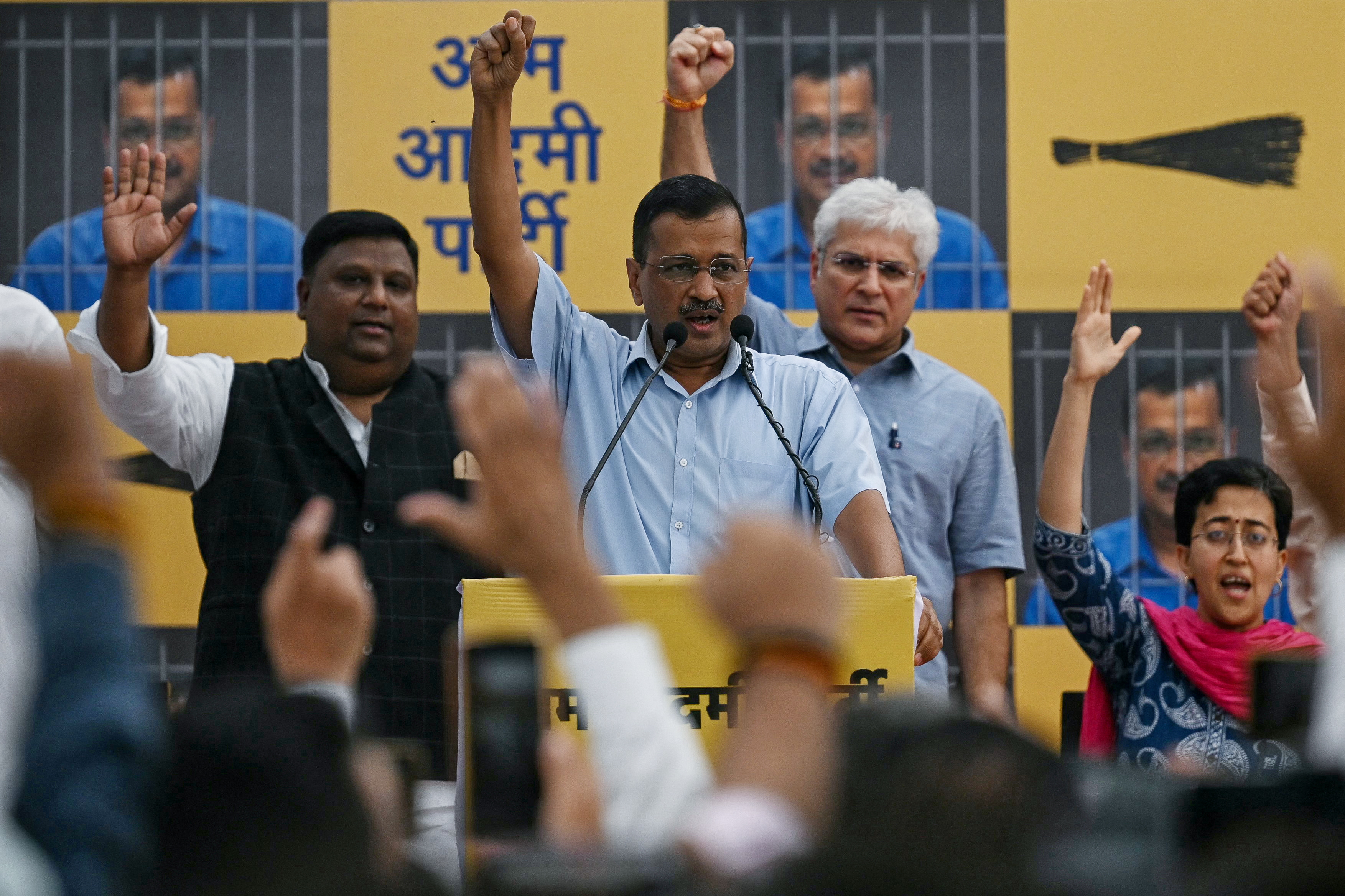 Arvind Kejriwal (C), Chief Minister of the capital Delhi and leader of the Aam Aadmi Party (AAP), addresses his supporters and party workers at the AAP's headquarters before returning to prison in New Delhi on June 2, 2024. Kejriwal, a top opponent of Prime Minister Narendra Modi said he would return to jail on June 2 as his bail conditions demand after elections that were widely expected to result in another landslide victory for the Hindu-nationalist leader. (Photo by Arun SANKAR / AFP)