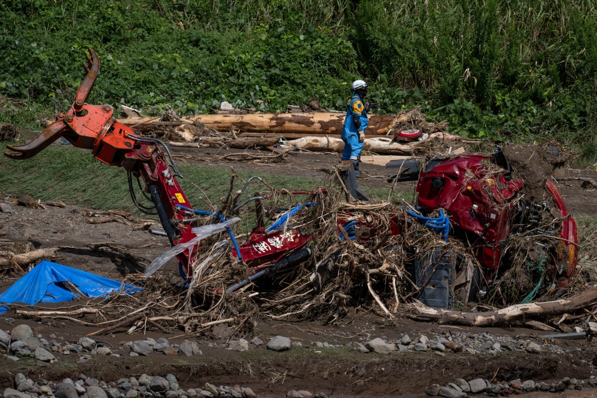 Rescuers comb muddy riverbanks after Japan floods kill six