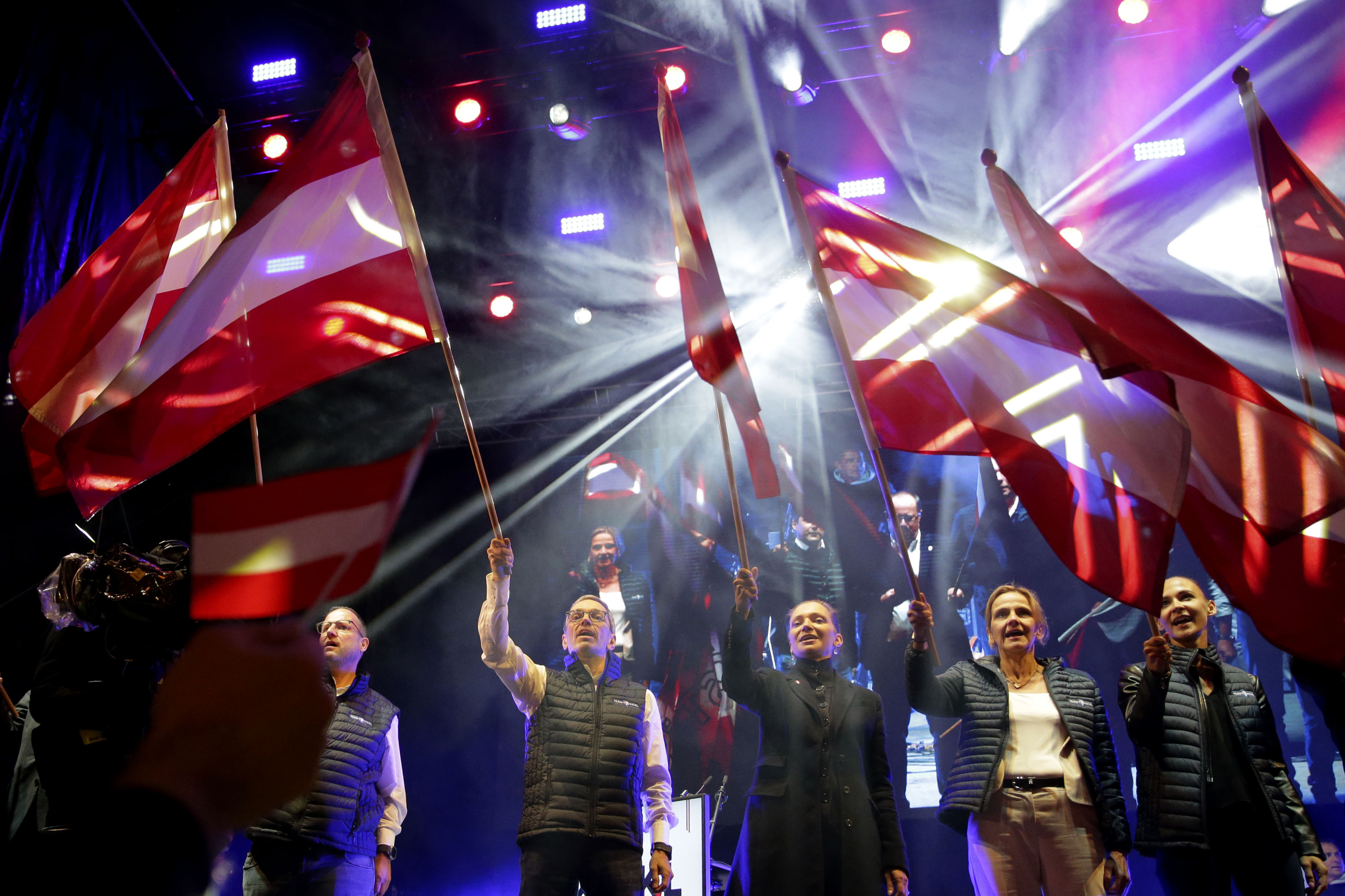 Head of the Freedom Party (FPOE) Herbert Kickl, center, celebrates with supporters during a final election campaign event at St. Stephen's square in Vienna, Austria, Friday, Sept. 27, 2024, ahead of the country's national election which will take place on Sept. 29. (AP Photo/Heinz-Peter Bader)