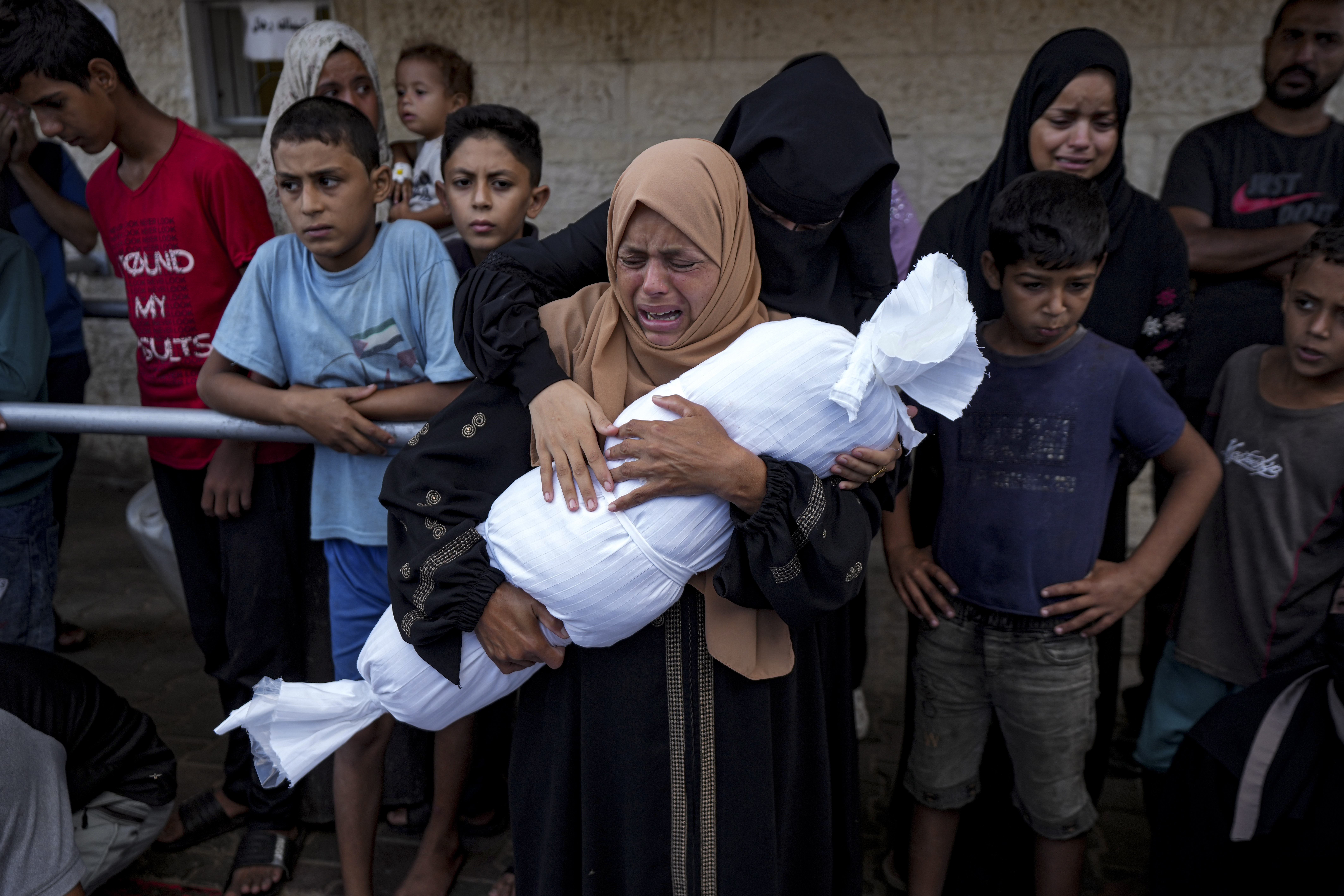 Palestinians mourn relatives killed in the Israeli bombardment
