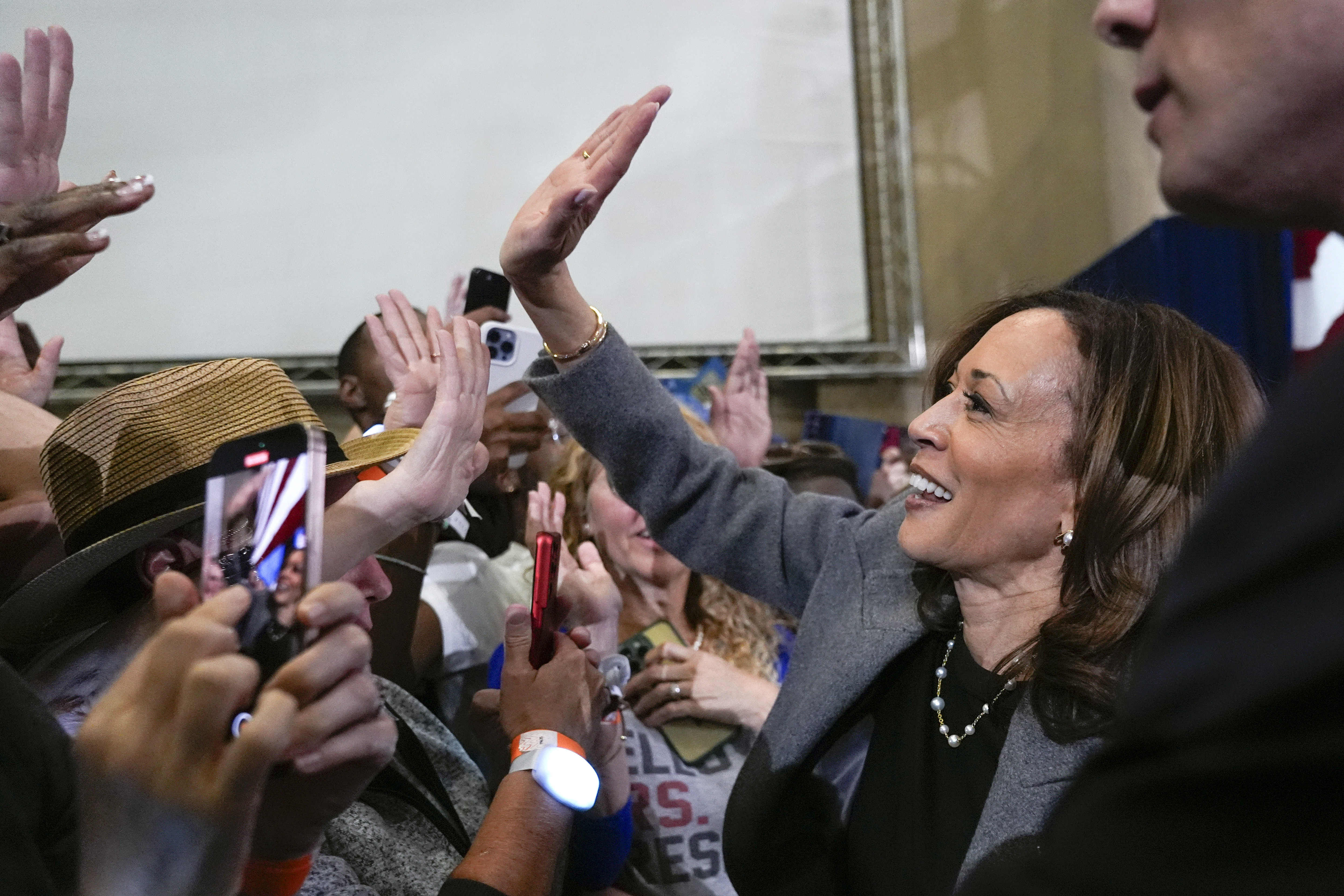Kamala Harris gives a supporter a high-five in Atlanta.
