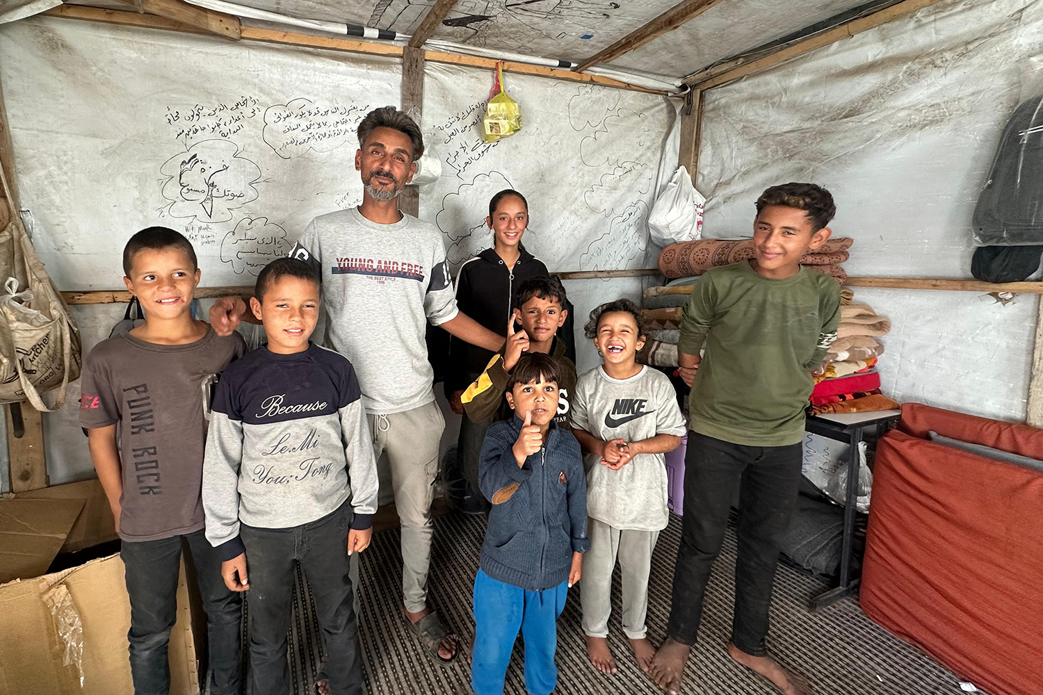 The Abu Ghaban family in Deir el-Balah displacement camp. As a family, they have been displaced since 1948