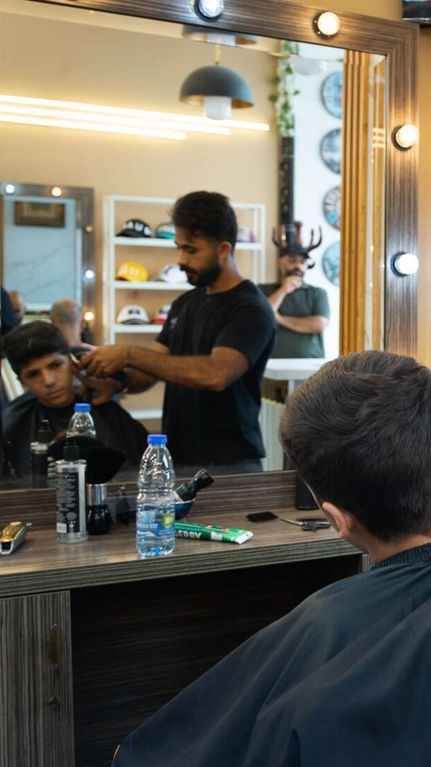 A barbershop in Dahiyeh, Lebanon, before Israel's destruction was unleashed on the people there [Lina Malers/Al Jazeera]