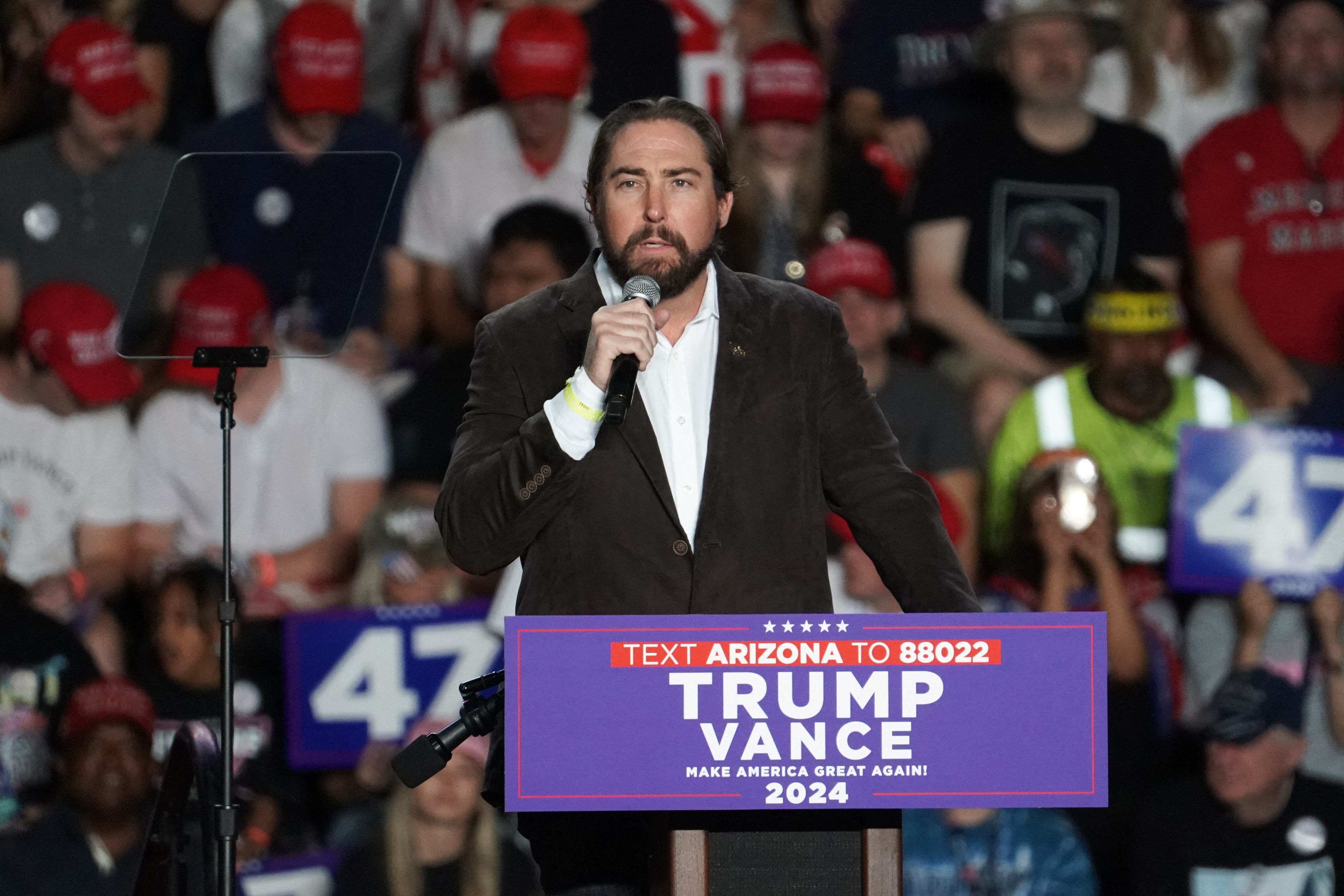 U.S. Representative Eli Crane (R-AZ) speaks during the rally of Republican presidential nominee and former U.S. President Donald Trump, at Mullett Arena in Tempe, Arizona, U.S. October 24, 2024. REUTERS/Go Nakamura