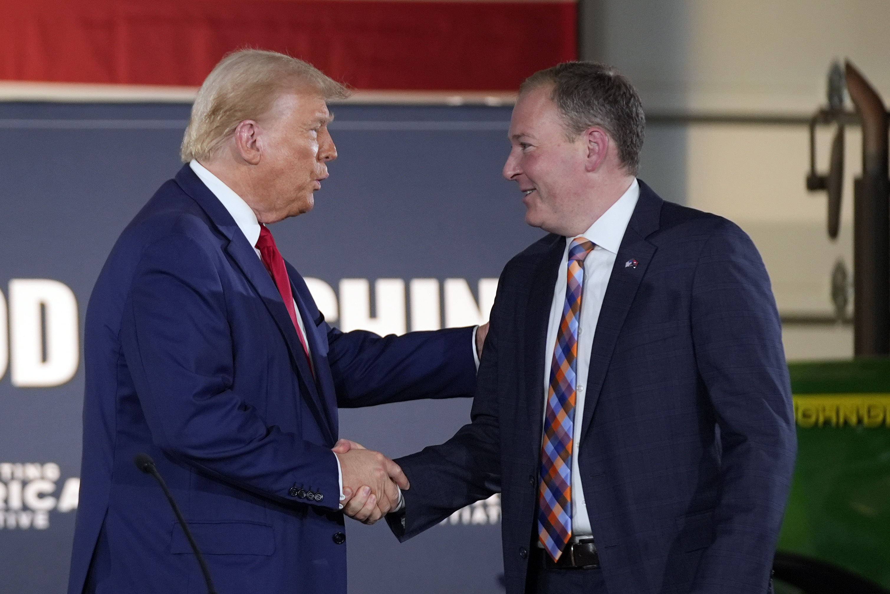 Donald Trump shakes hands with Lee Zeldin.