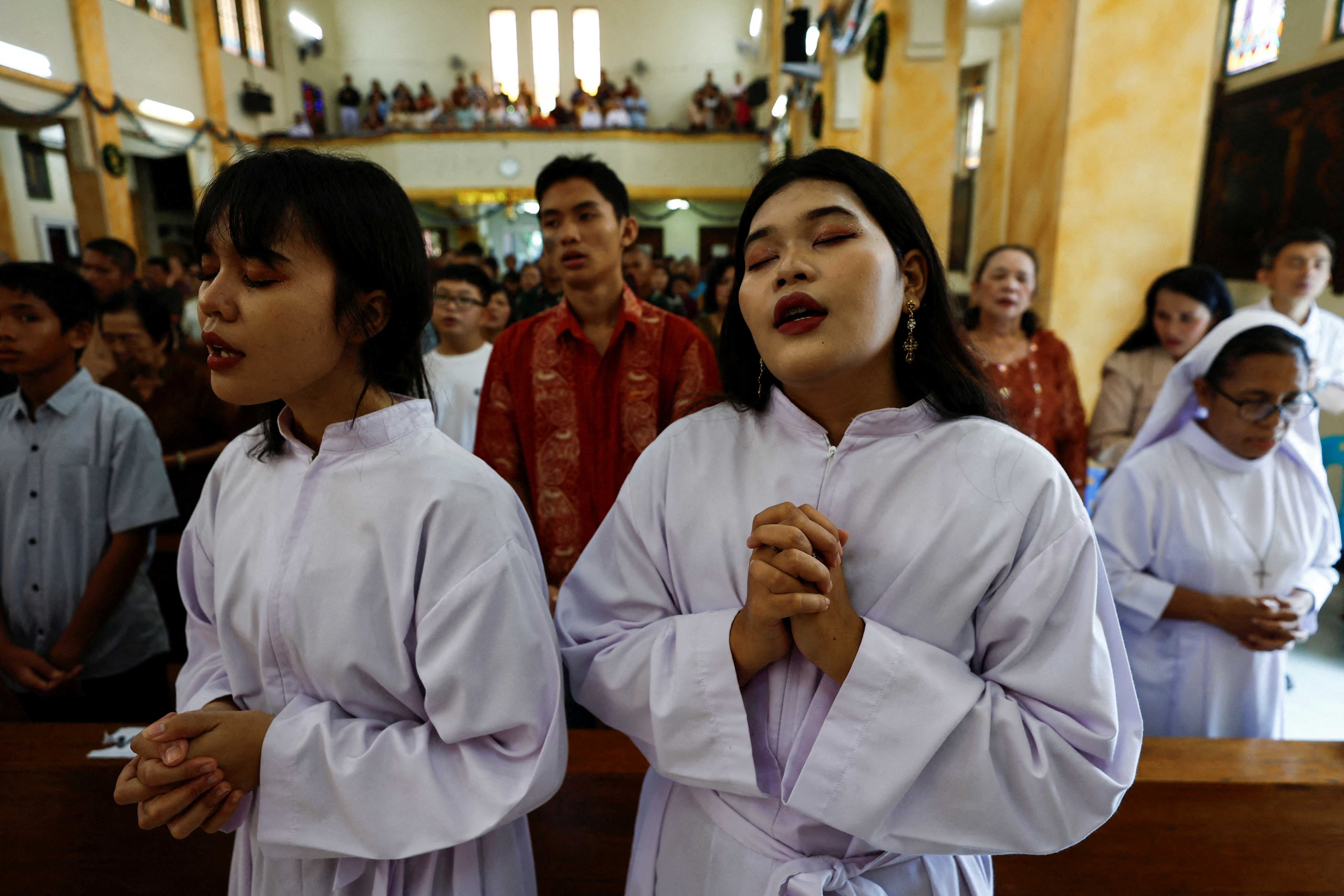 Catholics attend a mass during Christmas celebrations at the Sacred Heart Catholic Church, ahead of the 20th anniversary of Indian Ocean earthquake and tsunami, in Banda Aceh, Aceh, Indonesia, December 25