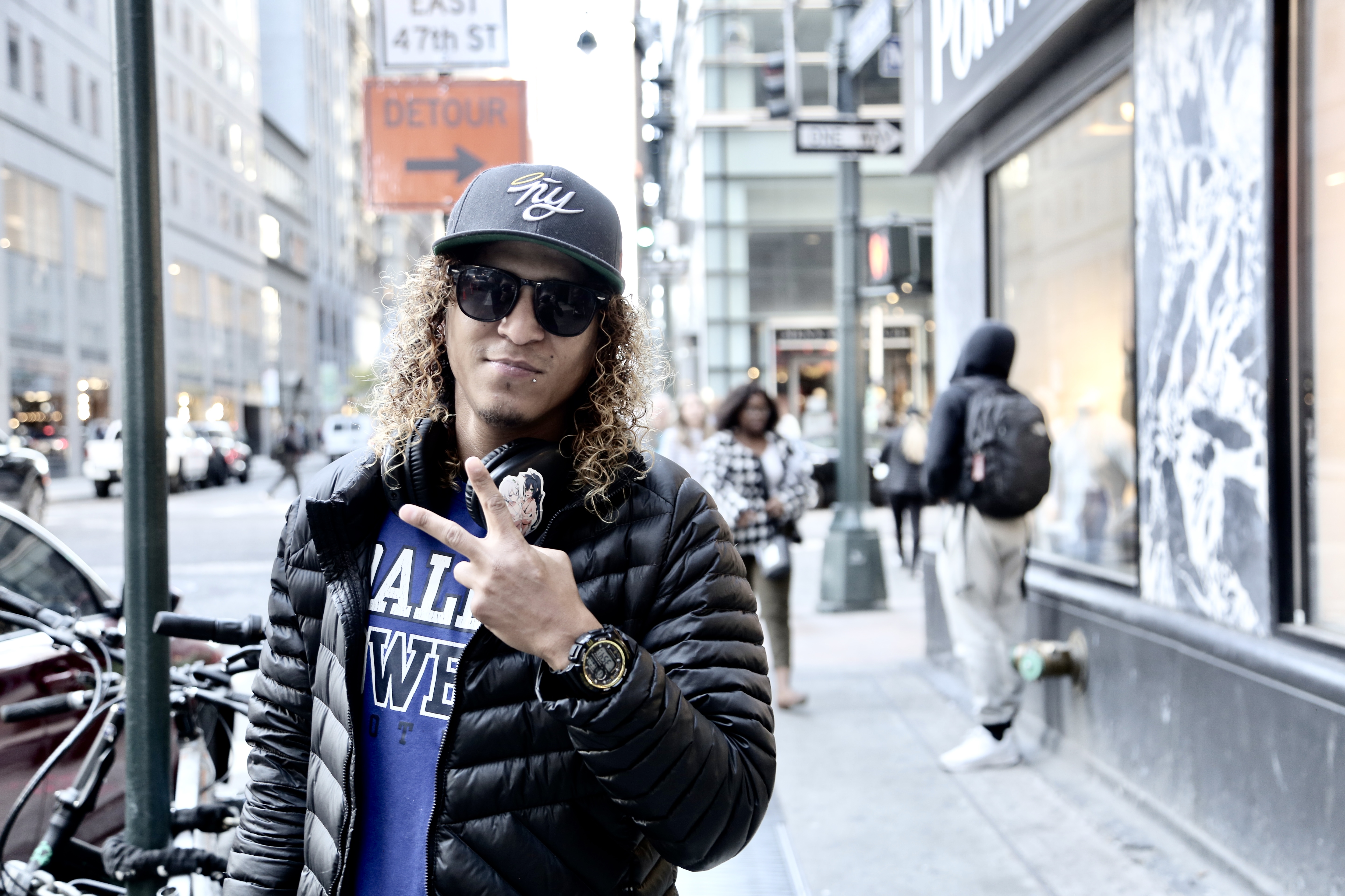 Anthony Morales flashes a backward peace sign