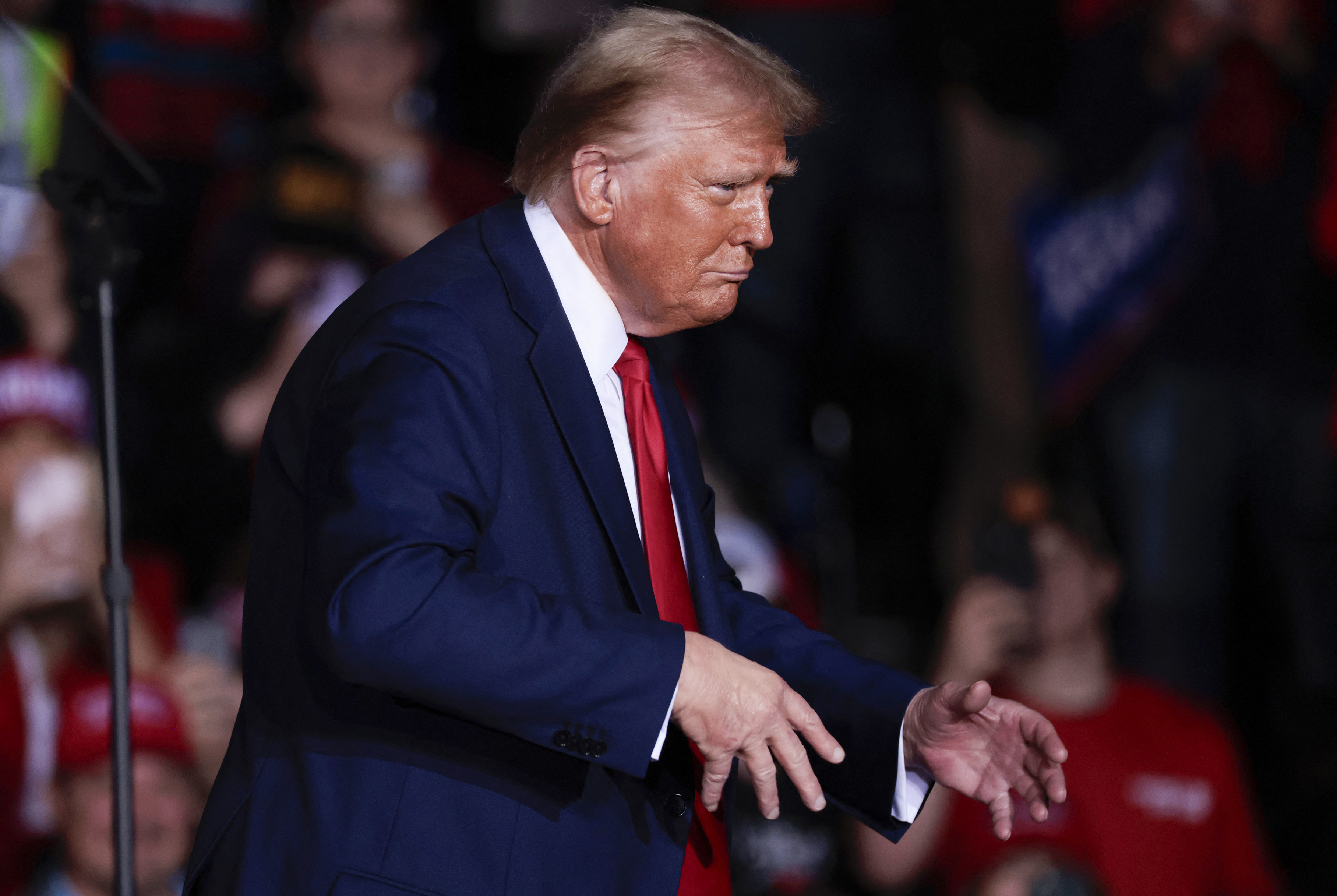 Former US President and Republican presidential candidate Donald Trump gestures as he leaves his last campaign rally at Van Andel Arena in Grand Rapids, Michigan on November 5, 2024.