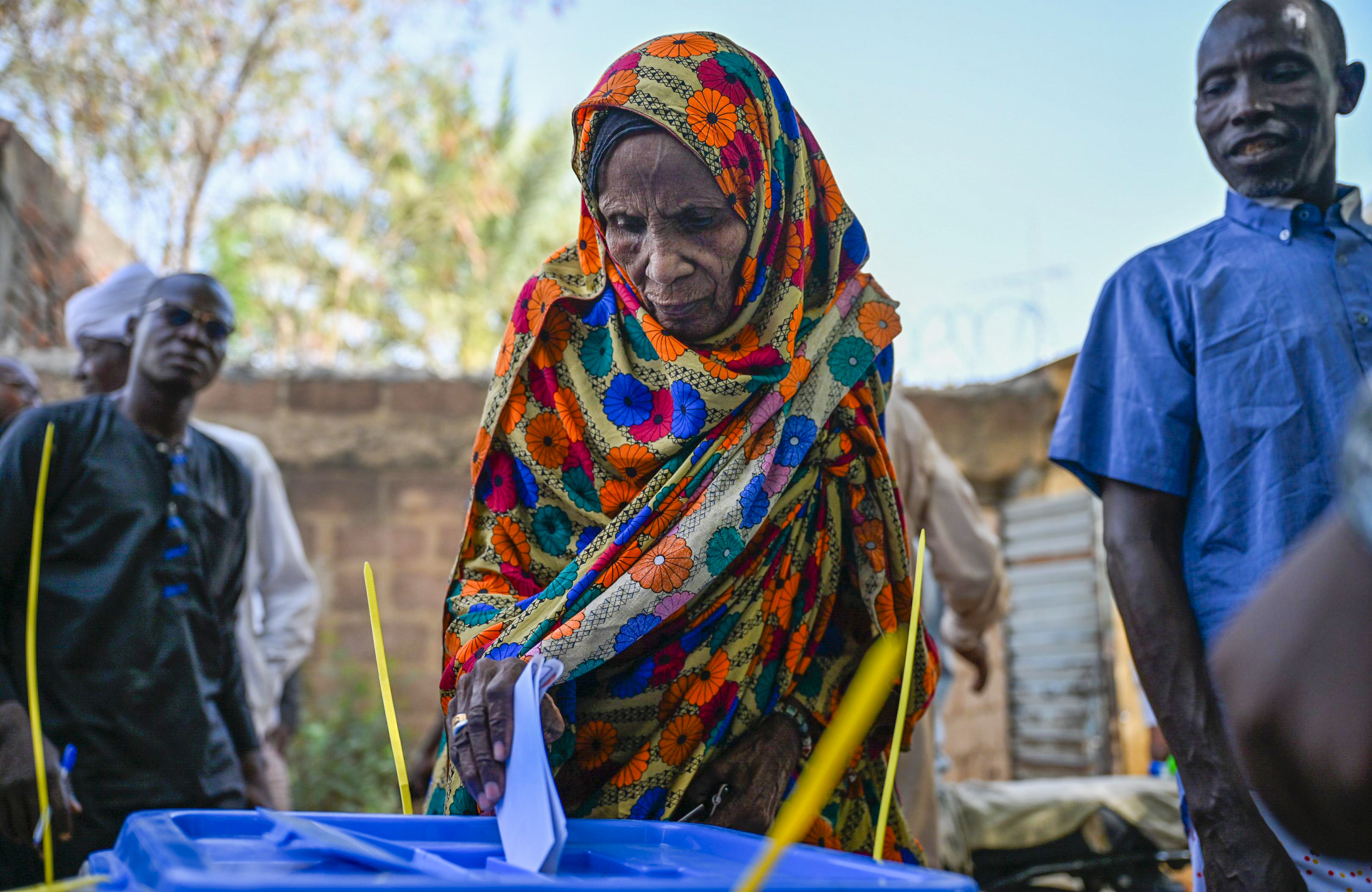 A woman casts her vote.