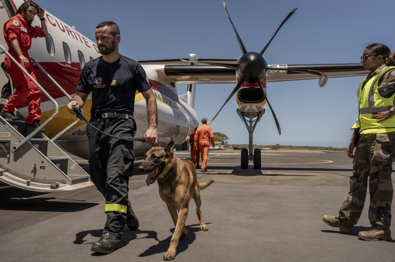 French civil security personnel board a flight to Mayotte from Saint-Denis on Reunion Island on December 17, 2024