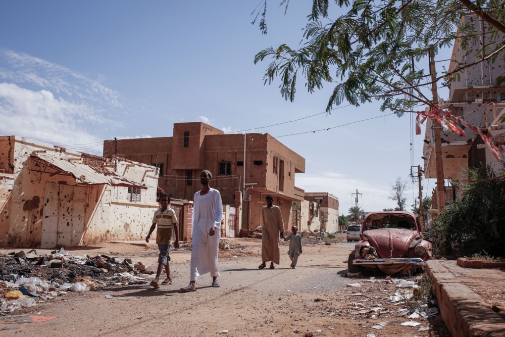 epa11700444 People walk along a street in Omdurman, Sudan, 01 November 2024 (issued 04 November 2024). On 02 November, Omdurman was under the control of the Sudanese Armed Forces. A civil war broke out April 2023 between the Sudanese military led by army chief Abdel Fattah al-Burhan, and the paramilitary Rapif Support Forces (RSF) led by Mohamed Hamdan Dagalo, the former Deputy Chairman of the Transitional Sovereignty Council of Sudan.The International Office for Migration (IOM) estimates that spme eight million people have been displaced internally or to neighbouring countries since April 2023 [EPA-EFE/Sara Creta]