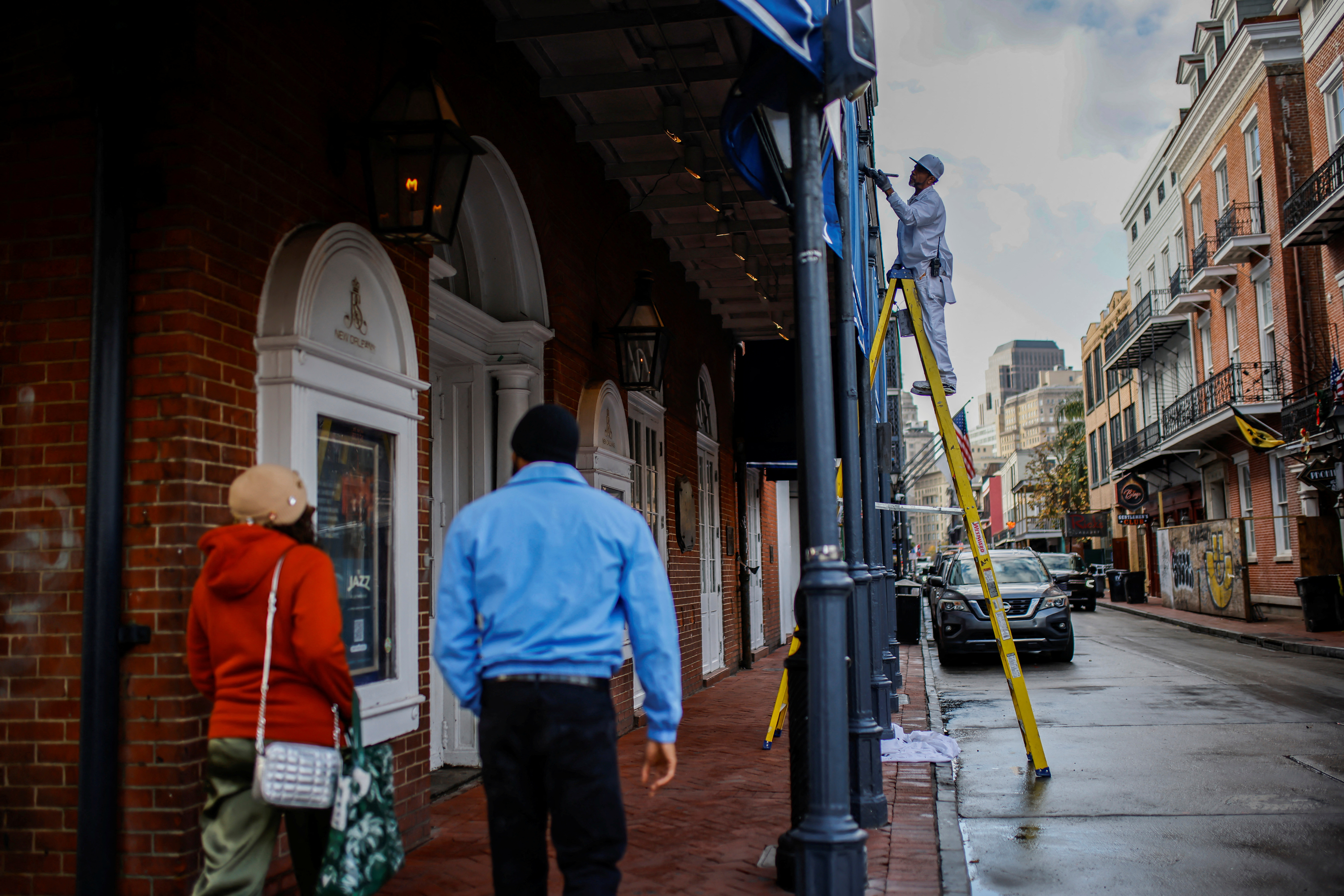 People walk along Bourbon's street after it was opened to regular traffic two days after a U.S. Army veteran drove his truck into the crowded French Quarter on New Year's Day in New Orleans, Louisiana, U.S. January 3