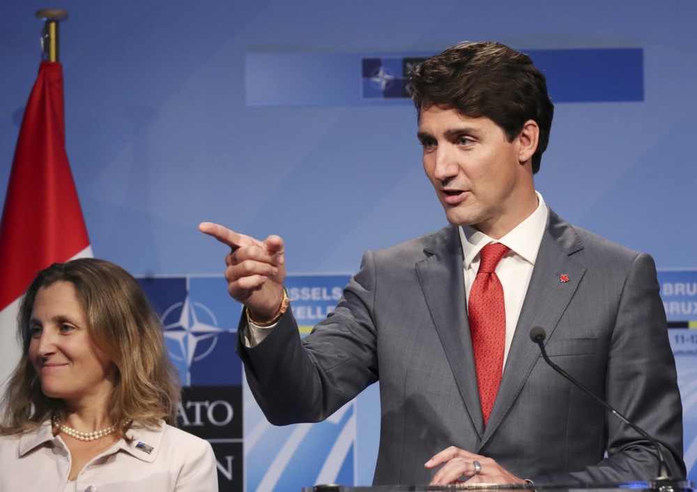 epa06883433 Canada's Foreign Minister Chrystia Freeland (L) and Canada's Prime Minister Justin Trudeau during a press conference on the second day of the NATO Summit in Brussels, Belgium, 12 July 2018. NATO member countries' heads of states and governments gather in Brussels on 11 and 12 July 2018 for a two days meeting. EPA-EFE/CHRISTIAN BRUNA