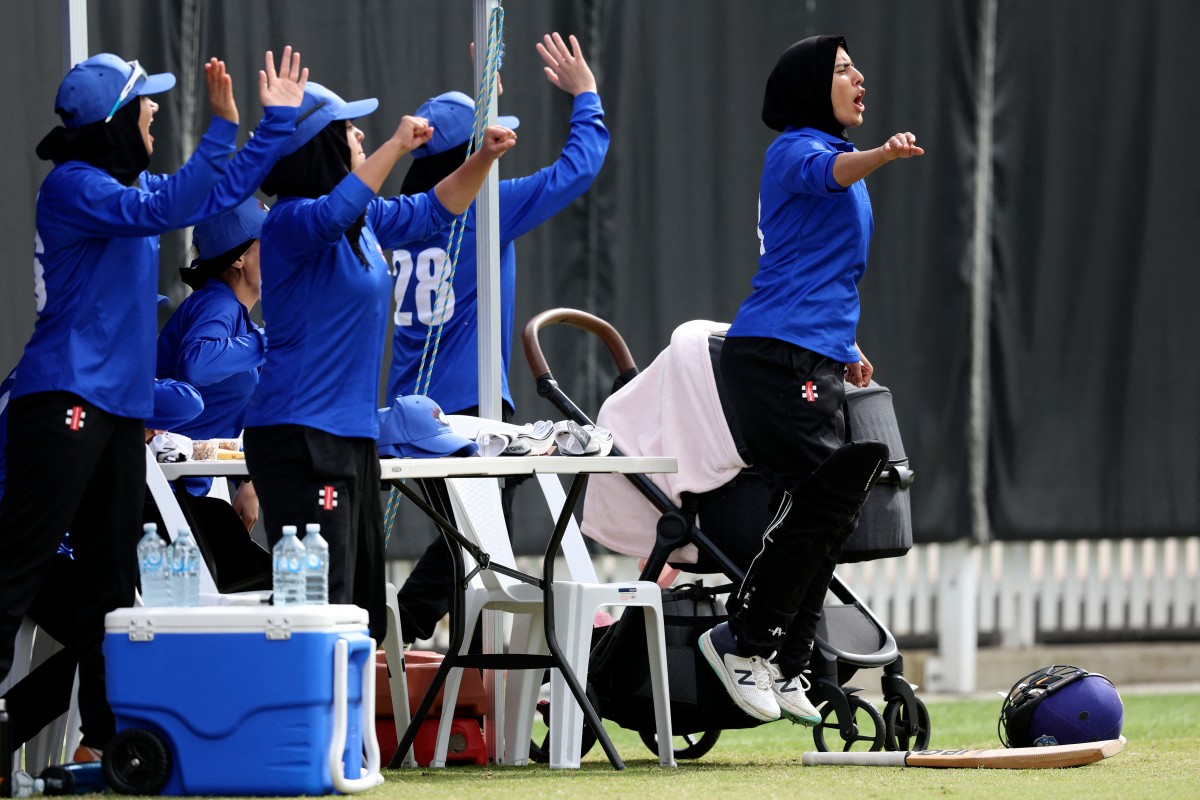 Afghanistan Women's XI players cheer