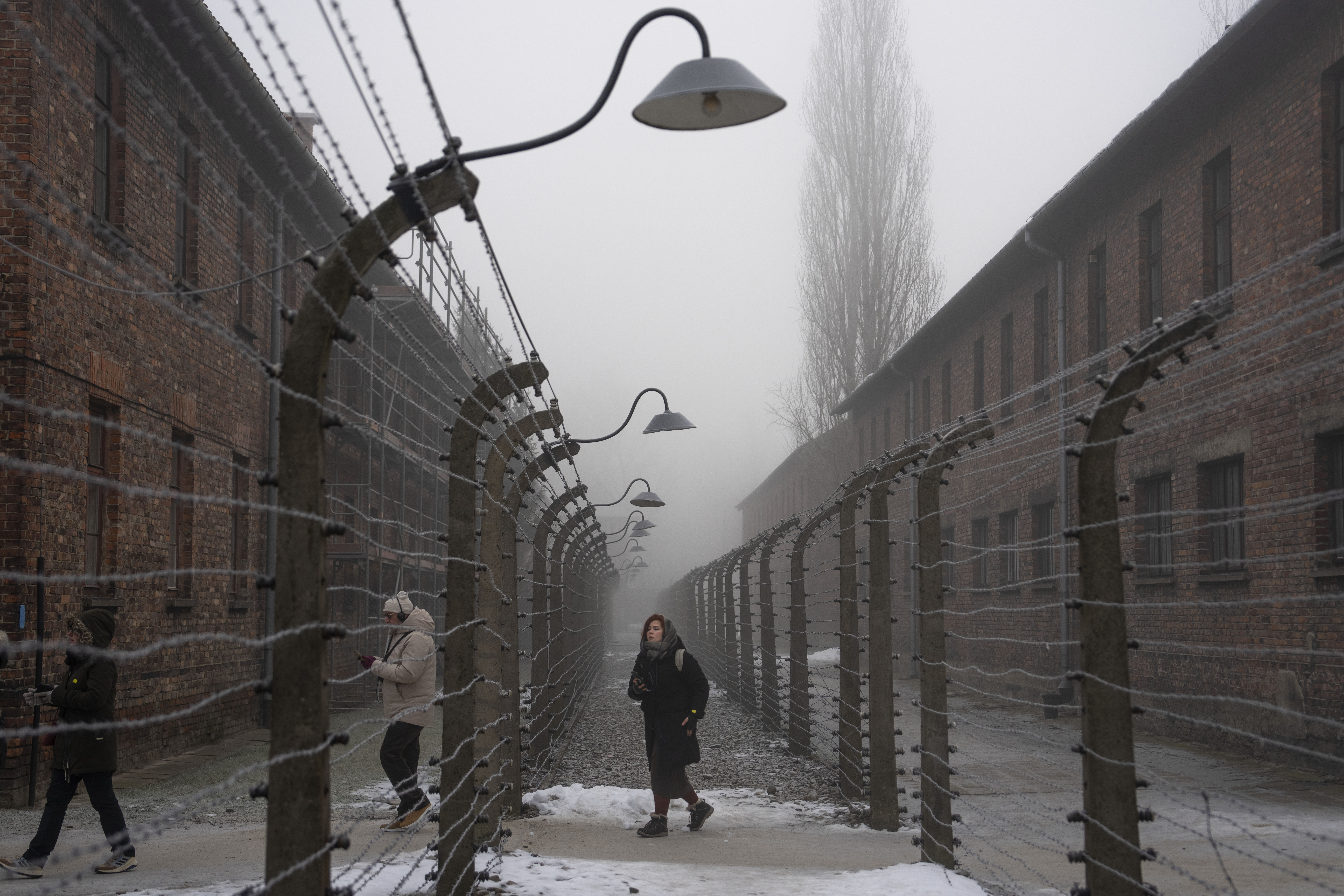 People visit the Memorial and Museum Auschwitz-Birkenau, the former Nazi German concentration and extermination camp, in Oswiecim, Poland on January 23, 2025