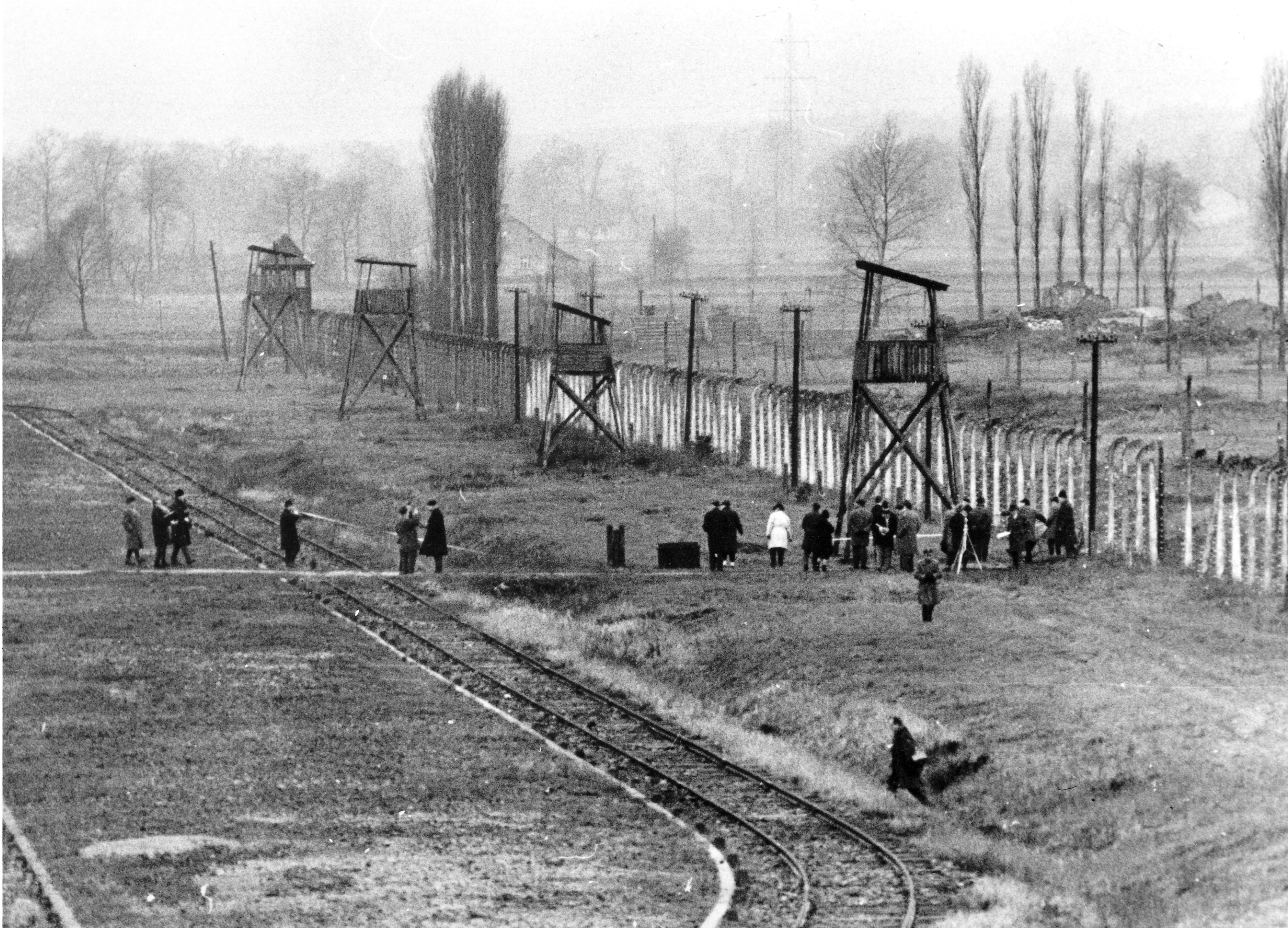 Members of the Auschwitz war crimes court inspect the former Nazi extermination centre in Poland in December 1964, where at least 1.1 million people, mostly Jews, were murdered during World War II, from 1940 until 1945