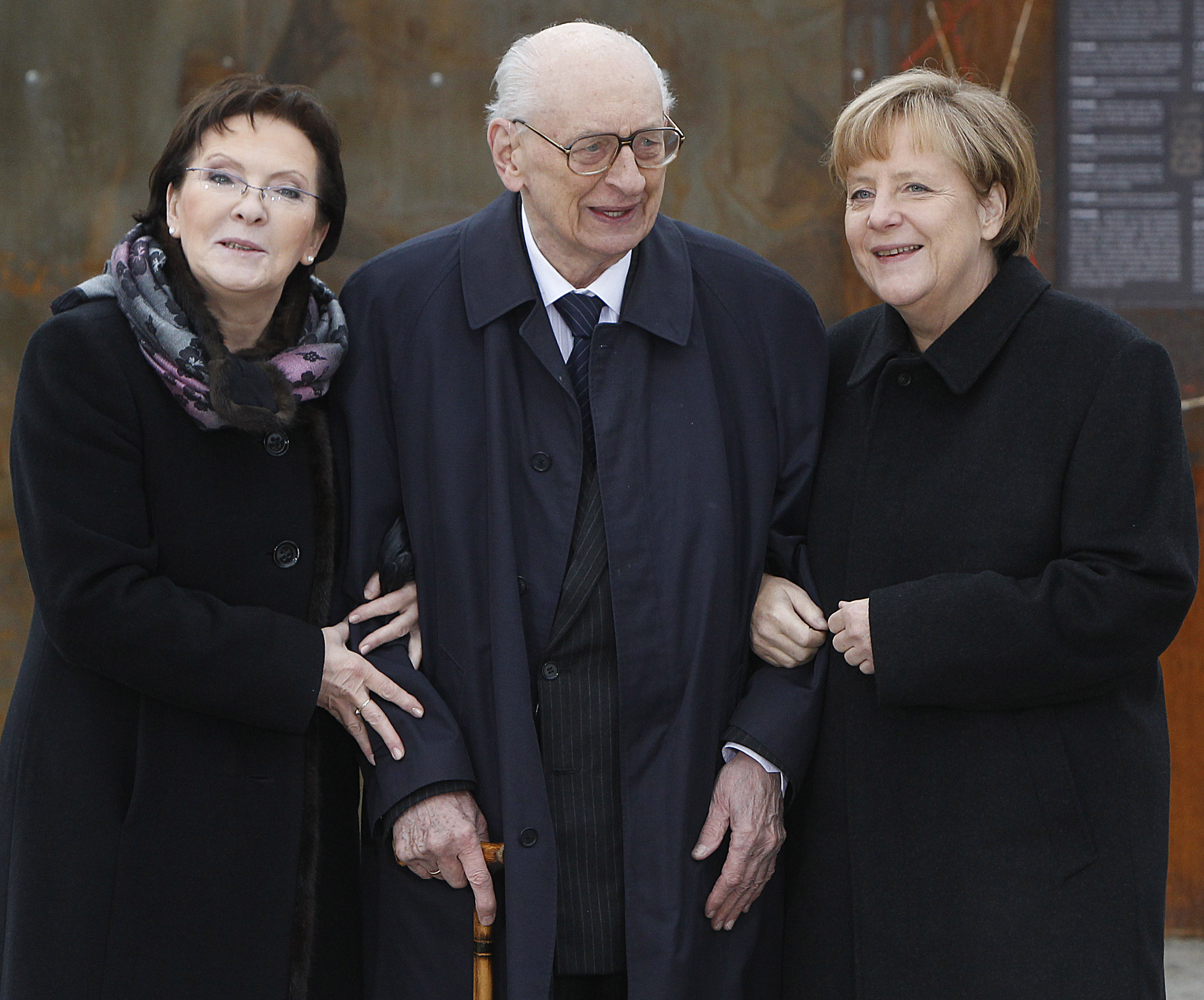 Poland’s Prime Minister Ewa Kopacz, left, former minister of foreign affairs, Wladyslaw Bartoszewski, centre, and German Chancellor Angela Merkel, right, pose during a visit of an exhibition in 2014 to commemorate 25 years since a symbolic reconciliation between the two neighbouring nations