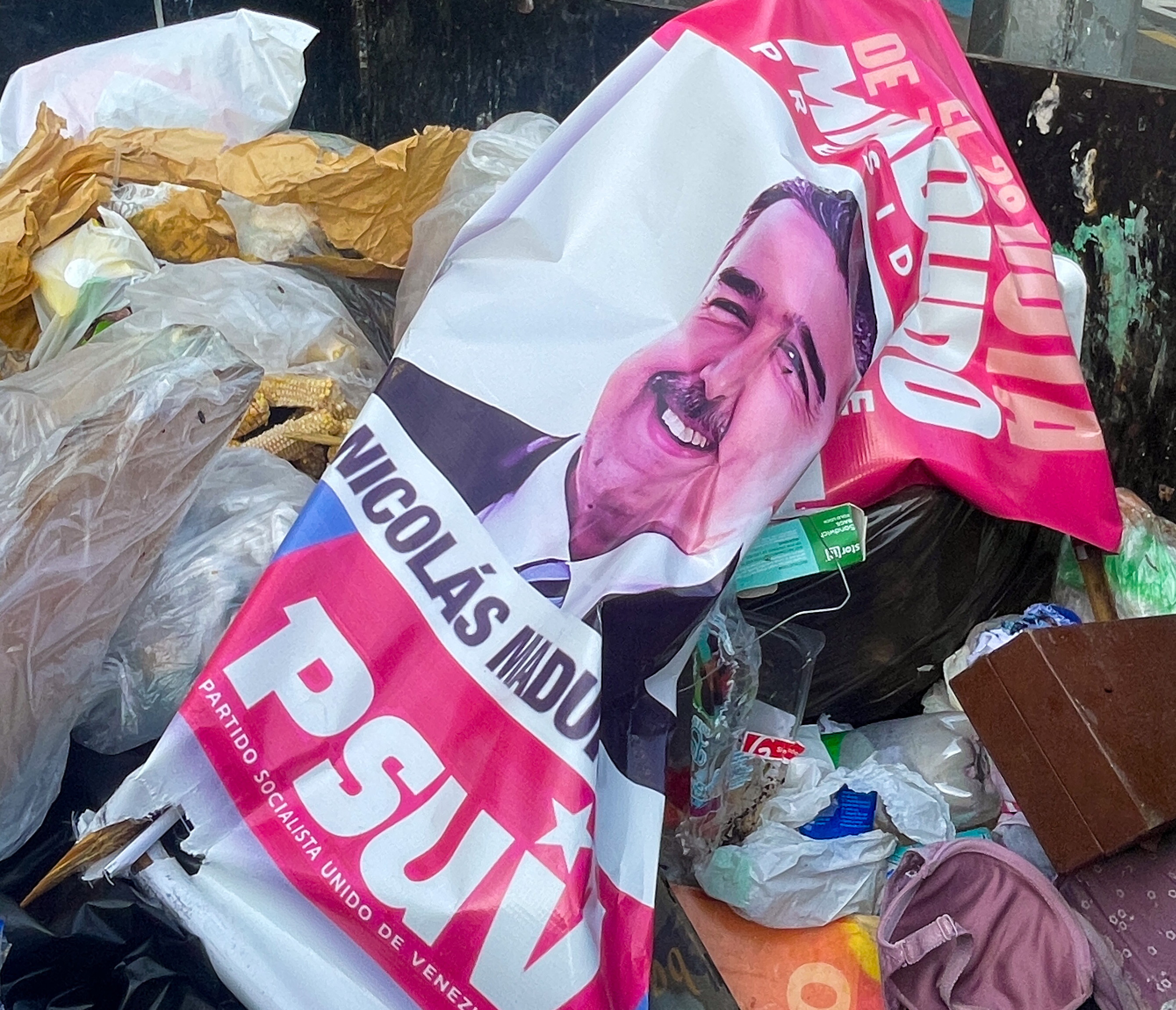 A balled up poster of Nicolas Maduro after the July 28 election