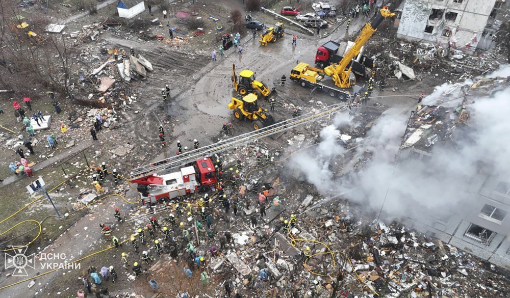 State Emergency Service workers of Ukraine work at the site of a rocket strike on a residential building in Poltava