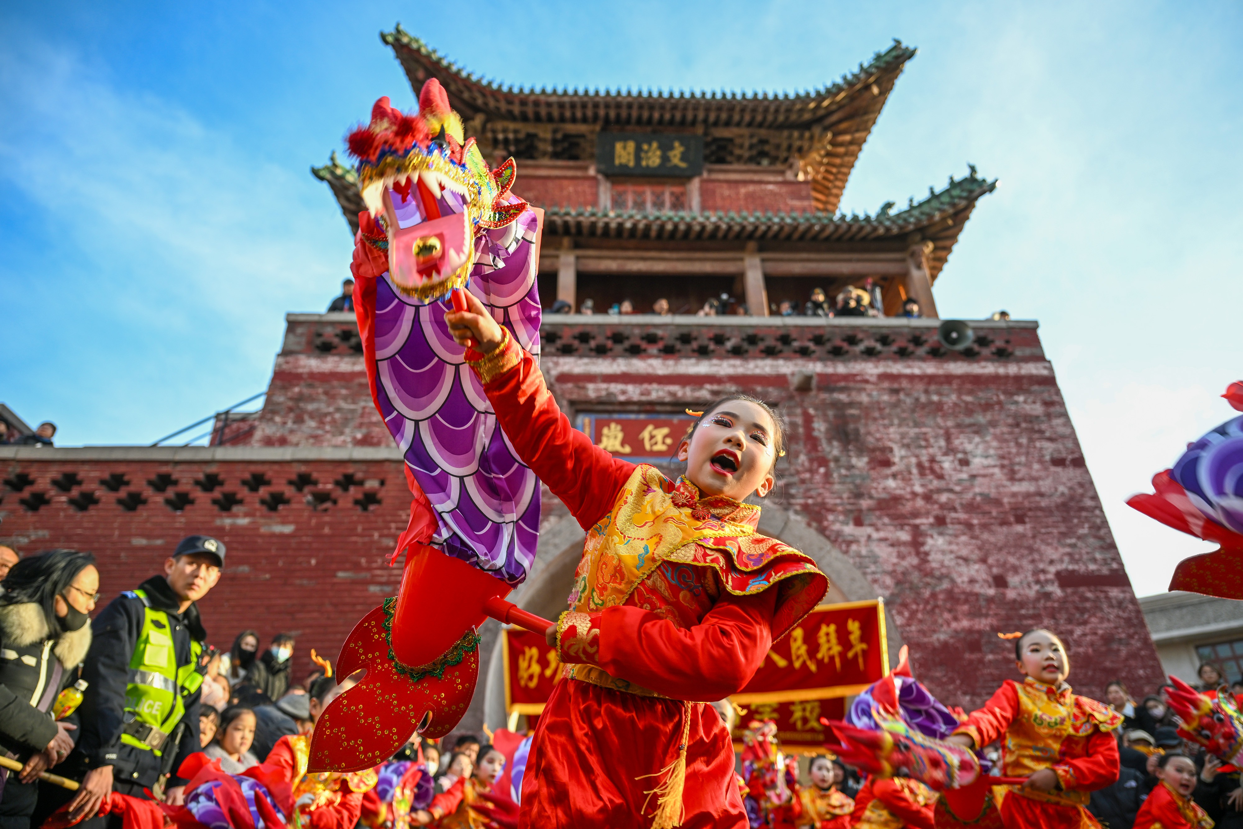 A child participates in a folk performance in Junxian County, central China's Henan Province, 12 February 2025. [Wang Gaochao/EPA-EFE &amp; Xinhua] (EPA)