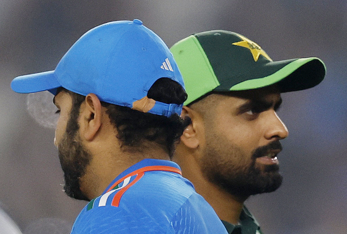 Cricket - ICC Cricket World Cup 2023 - India v Pakistan - Narendra Modi Stadium, Ahmedabad, India - October 14, 2023 India's Rohit Sharma and Pakistan's Babar Azam after the match REUTERS/Adnan Abidi