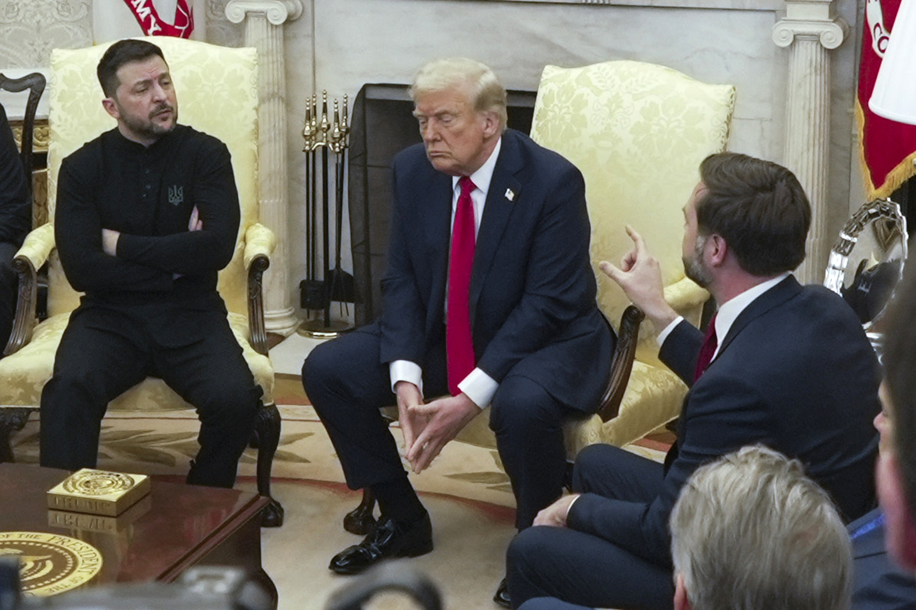 JD Vance, Donald Trump and Volodymyr Zelenskyy sit in the Oval Office