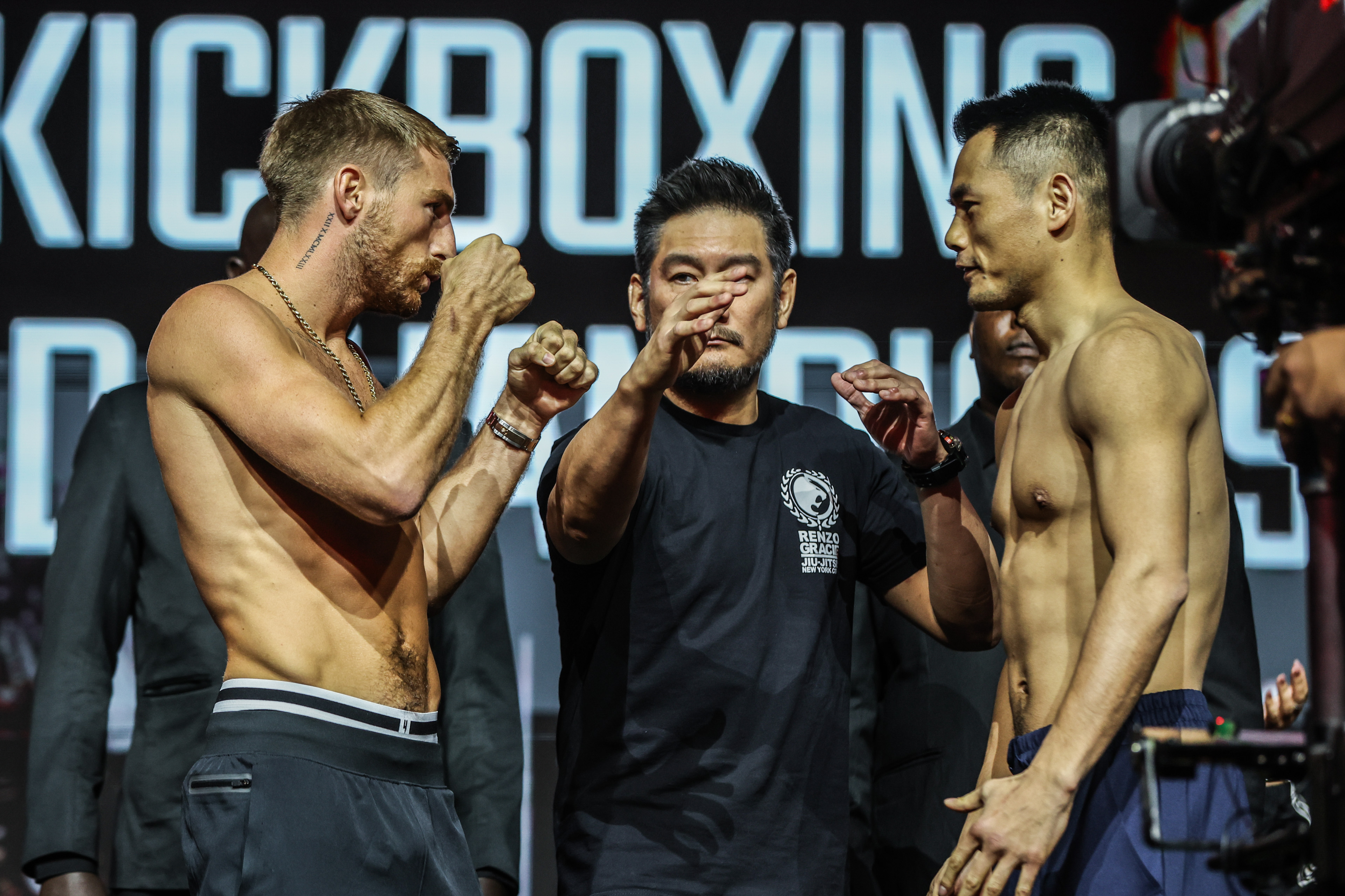 Jonathan Haggerty, left, and Wei Rui face off at weigh-in before their ONE Bantamweight Kickboxing world championship bout at Lusail Sports Arena, near Doha, Qatar on February 20, 2025