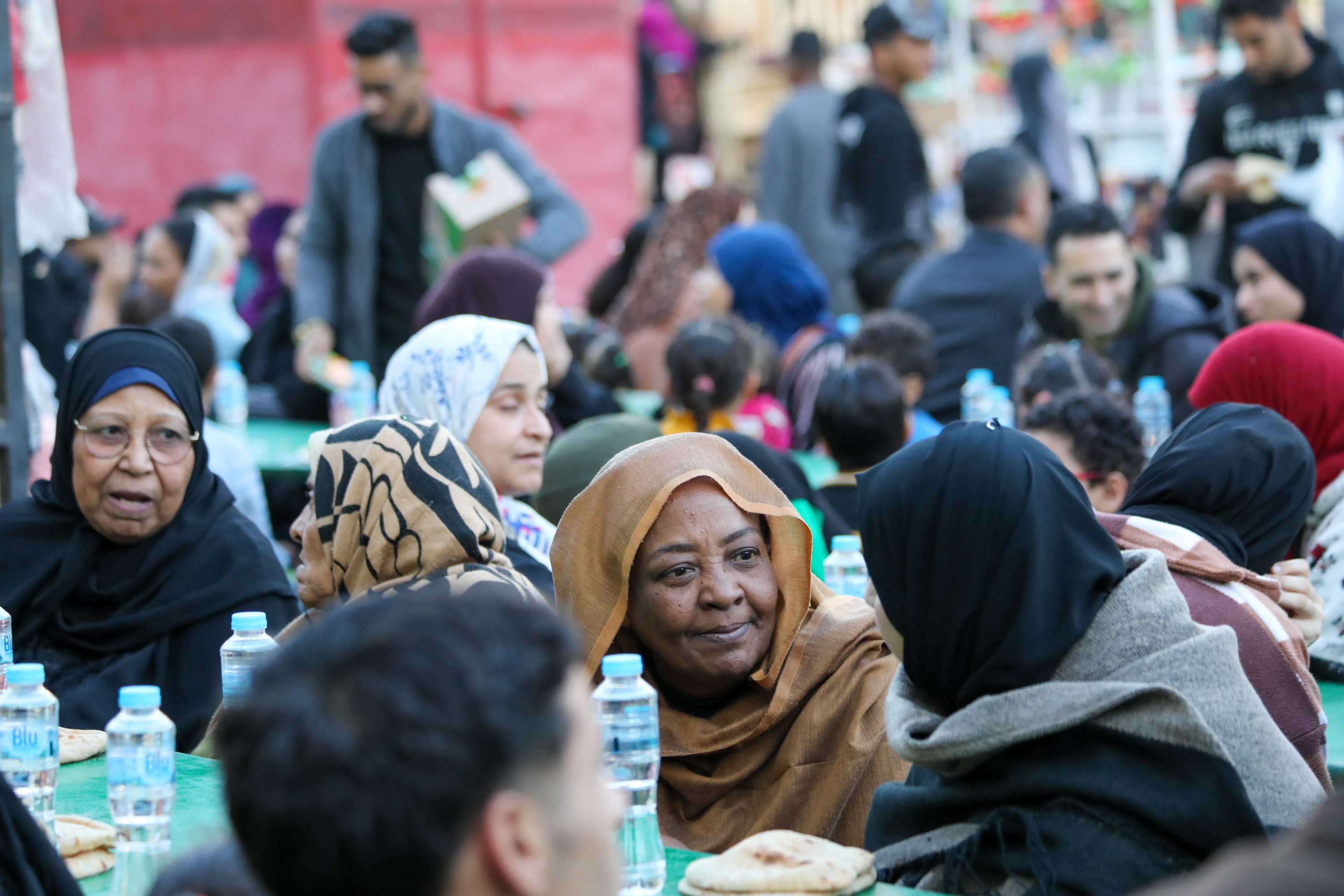 People from different areas of Cairo come to break their fast near Sayeda Zeinab’s important mosque. A group of old Sudanese women are also found at a corner