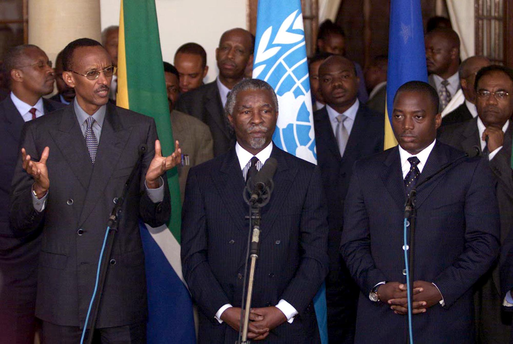From left: Presidents Paul Kagame of Rwanda, Thabo Mbeki of South Africa, and Joseph Kabila of the DRC, address a news conference after meeting in Pretoria, South Africa, in November 2002. The meeting took place to review the implementation of a peace deal signed between the DRC and Rwanda aimed at ending the Congolese war