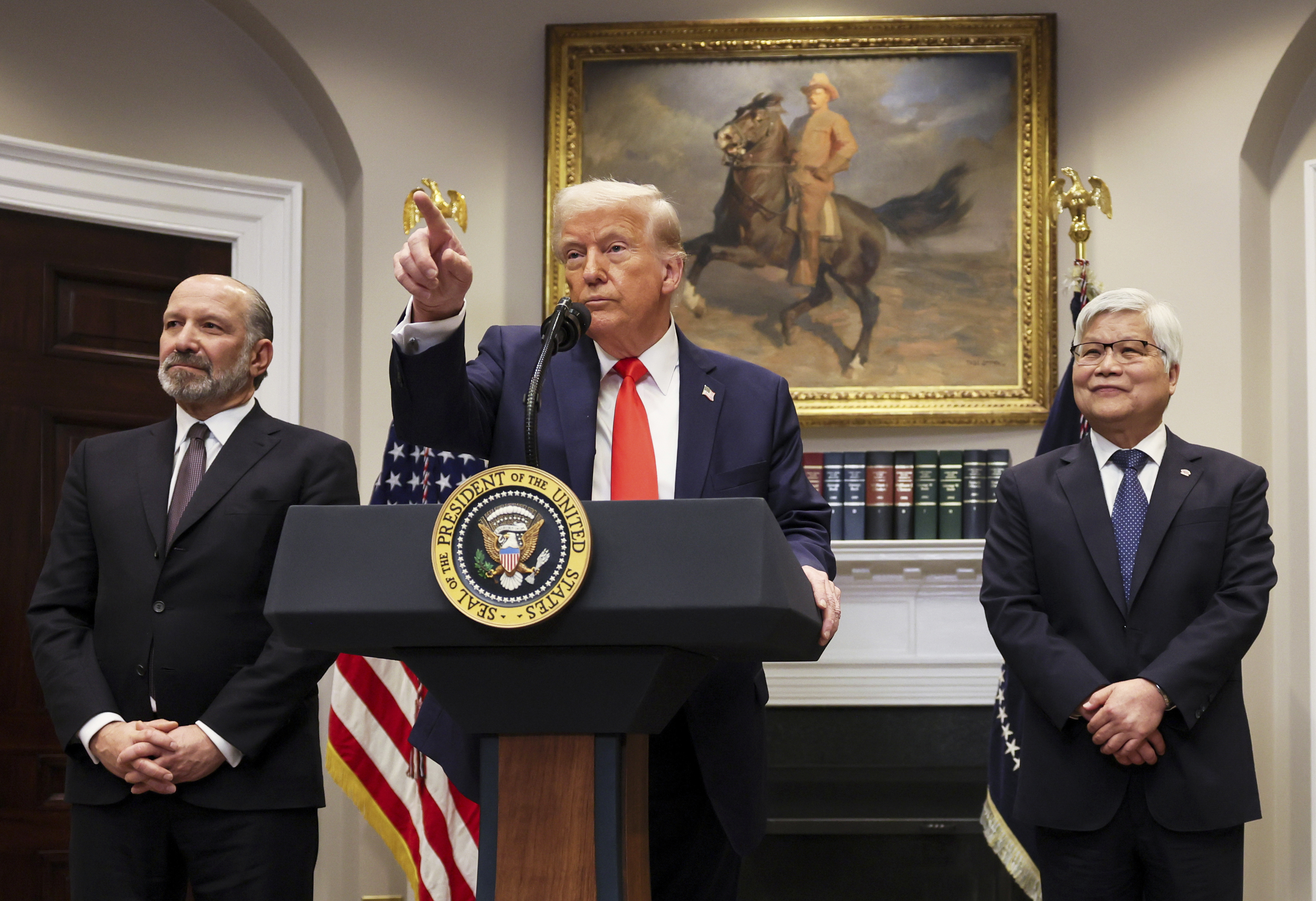 US President Donald Trump speaks as CC Wei, chairman and CEO of Taiwan Semiconductor Manufacturing Company, and US Commerce Secretary Howard Lutnick listen in the Roosevelt Room of the White House in Washington, DC, the US, on March 3, 2025 [Pool via AP]