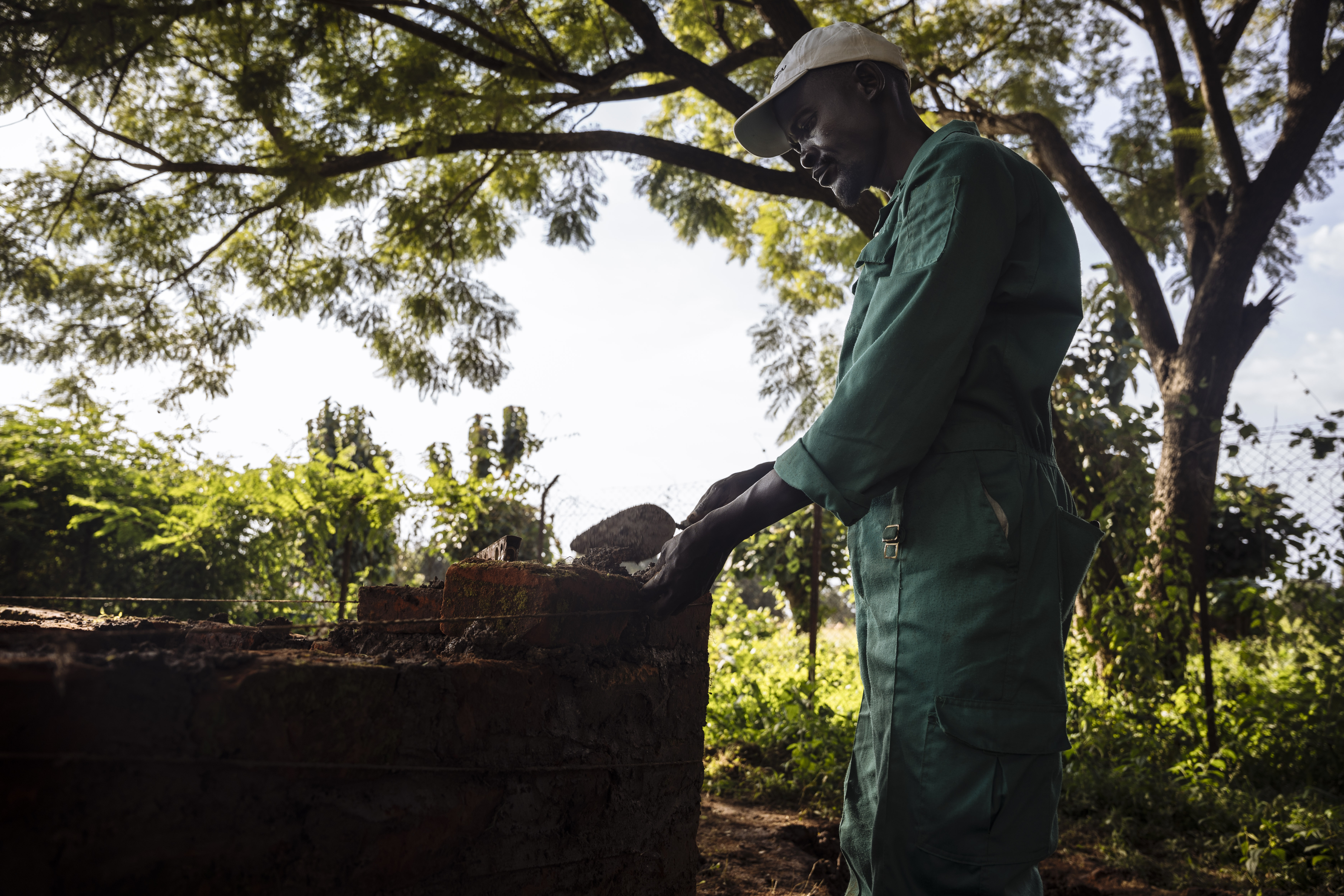 Joel John, a father of five in Yei, rebuilds his life through carpentry skills learned in vocational training provided by IOM—turning hardship into hope while navigating the challenges of post-conflict South Sudan. Muse Mohammed/IOM