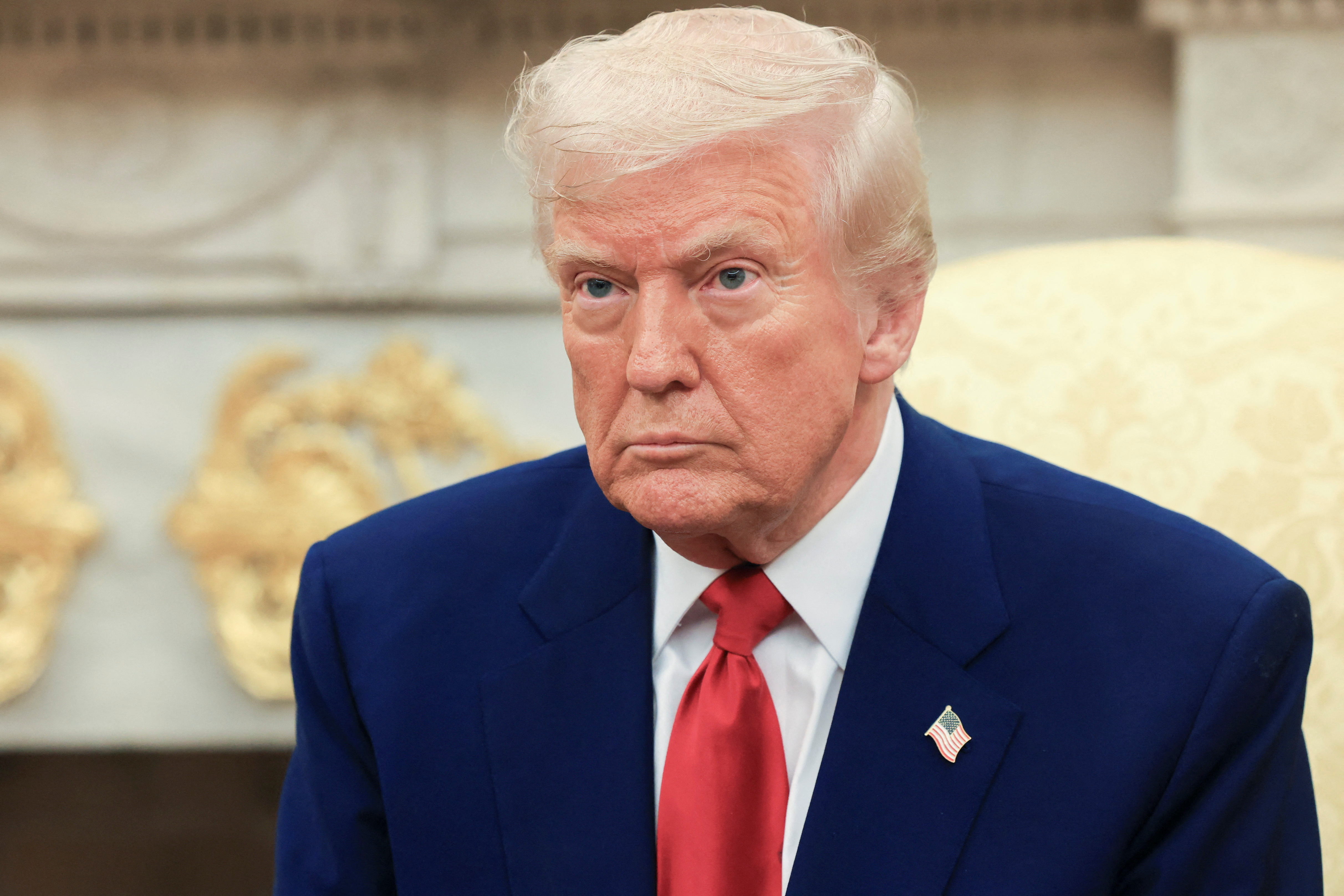U.S. President Donald Trump looks on during a meeting with Israeli Prime Minister Benjamin Netanyahu (not pictured) in the Oval Office at the White House in Washington, U.S., April 7, 2025. REUTERS/Kevin Mohatt