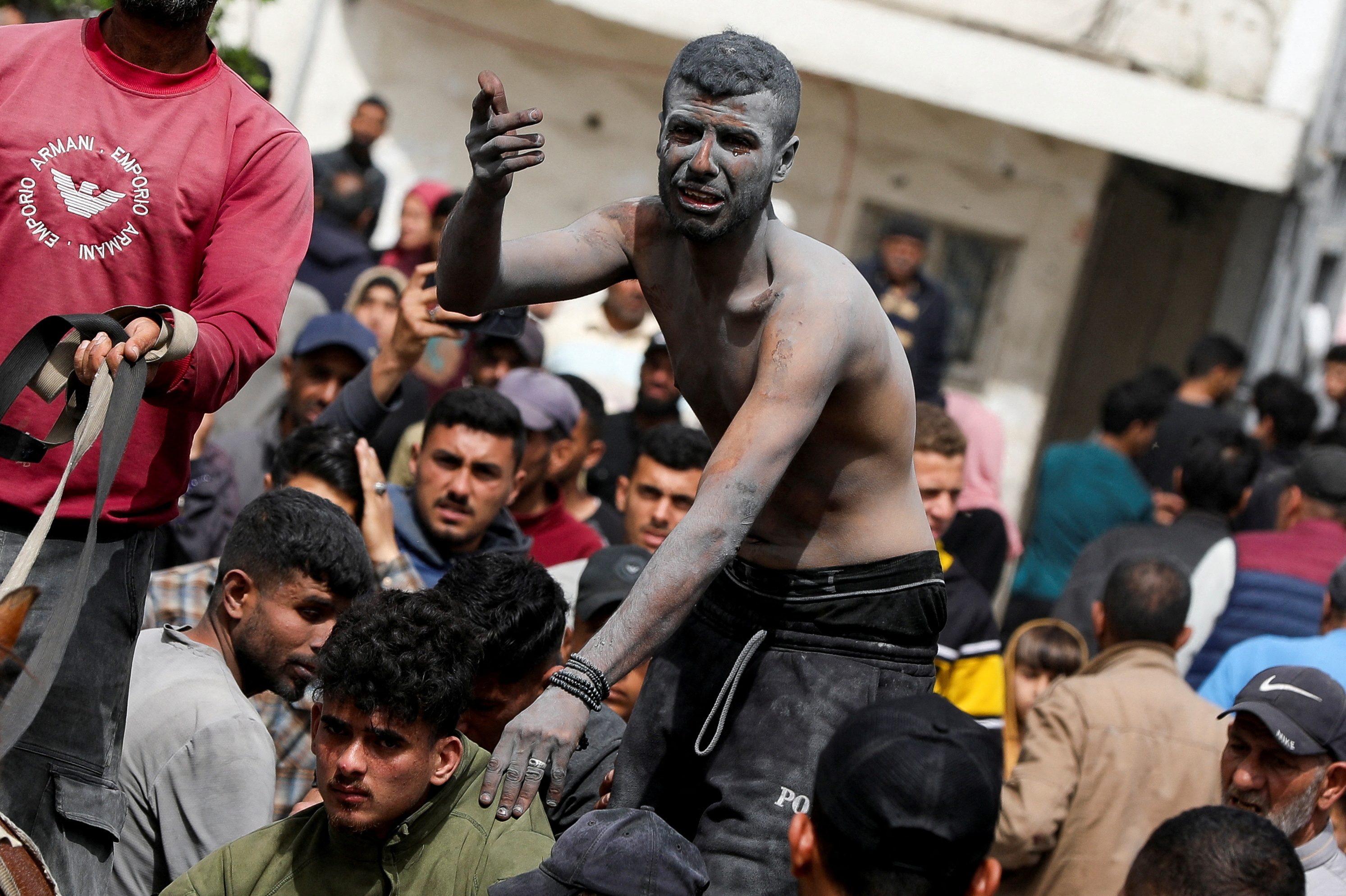 Palestinian casualties are rushed into Al-Ahli Arab Baptist Hospital